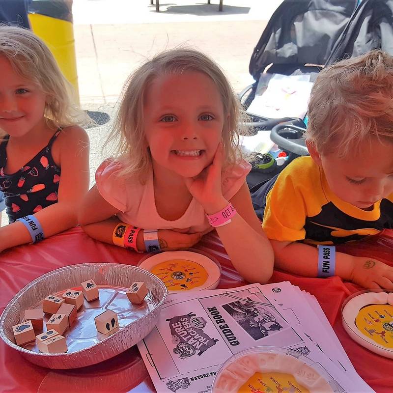Kids having fun at WPSU Kid's day activity tent.