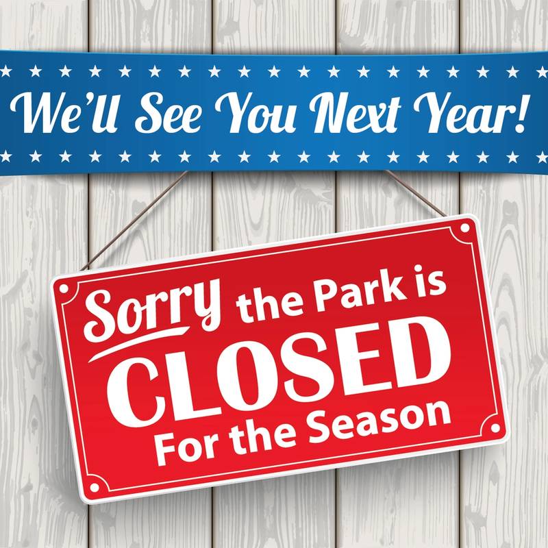 Banner and sign stating the park is closed for the season - see you next year.