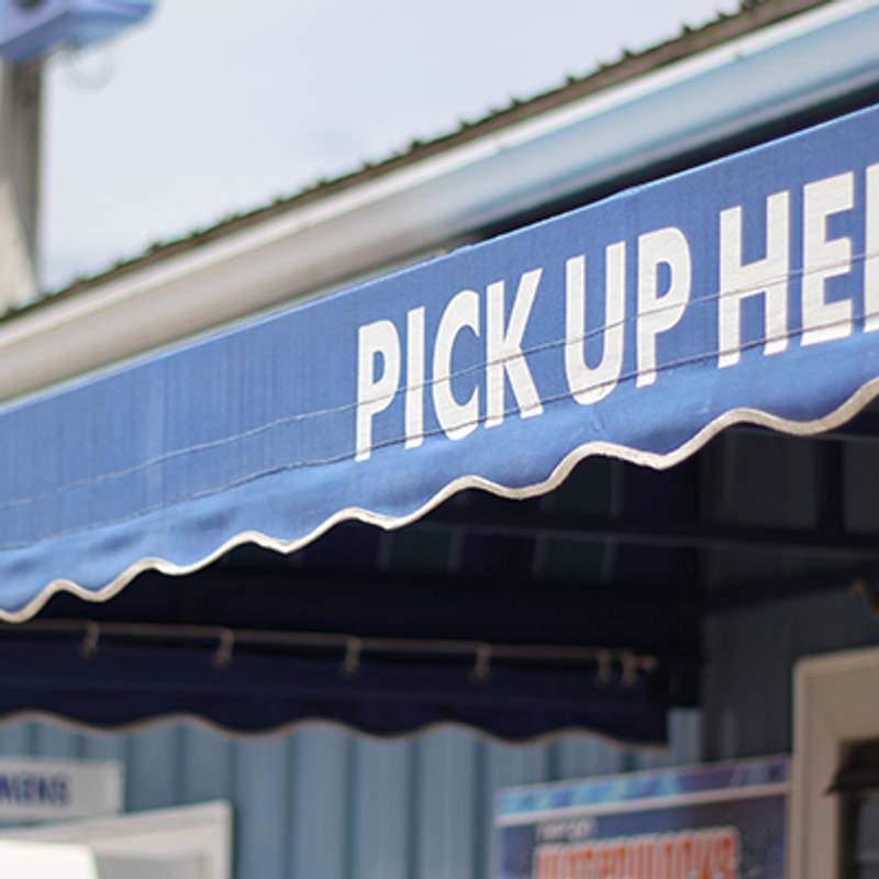 Order and Pick Up Here signs at Laguna Snacks concession stand