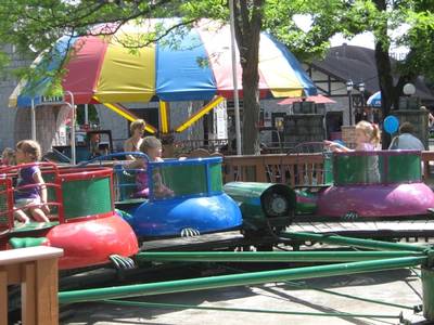 Kids riding the Turtles Kiddie Ride at DelGrosso's Amusement Park