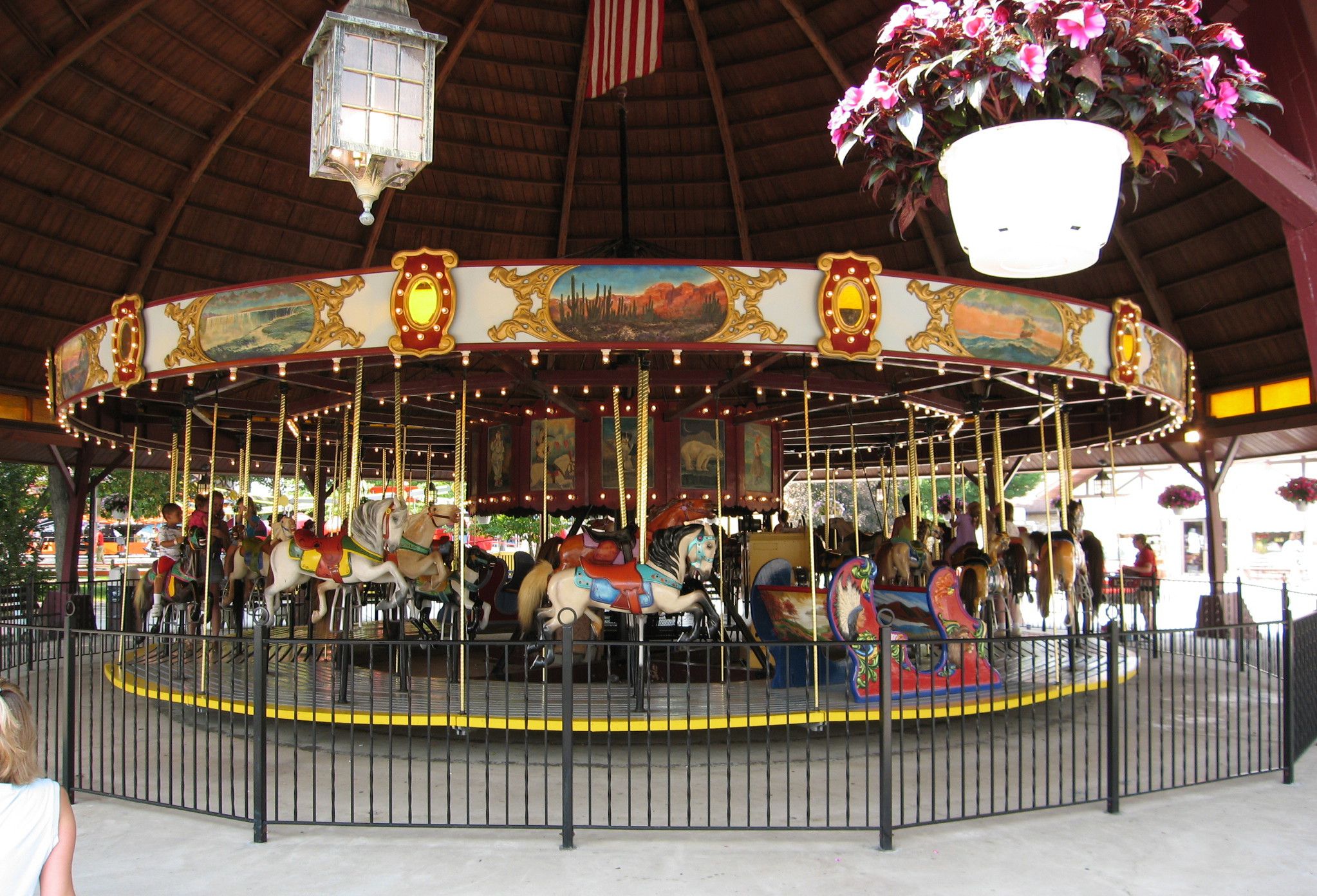 DelGrosso's Mascot Buddy Bear with mask on pointing to Play Safe With Us text