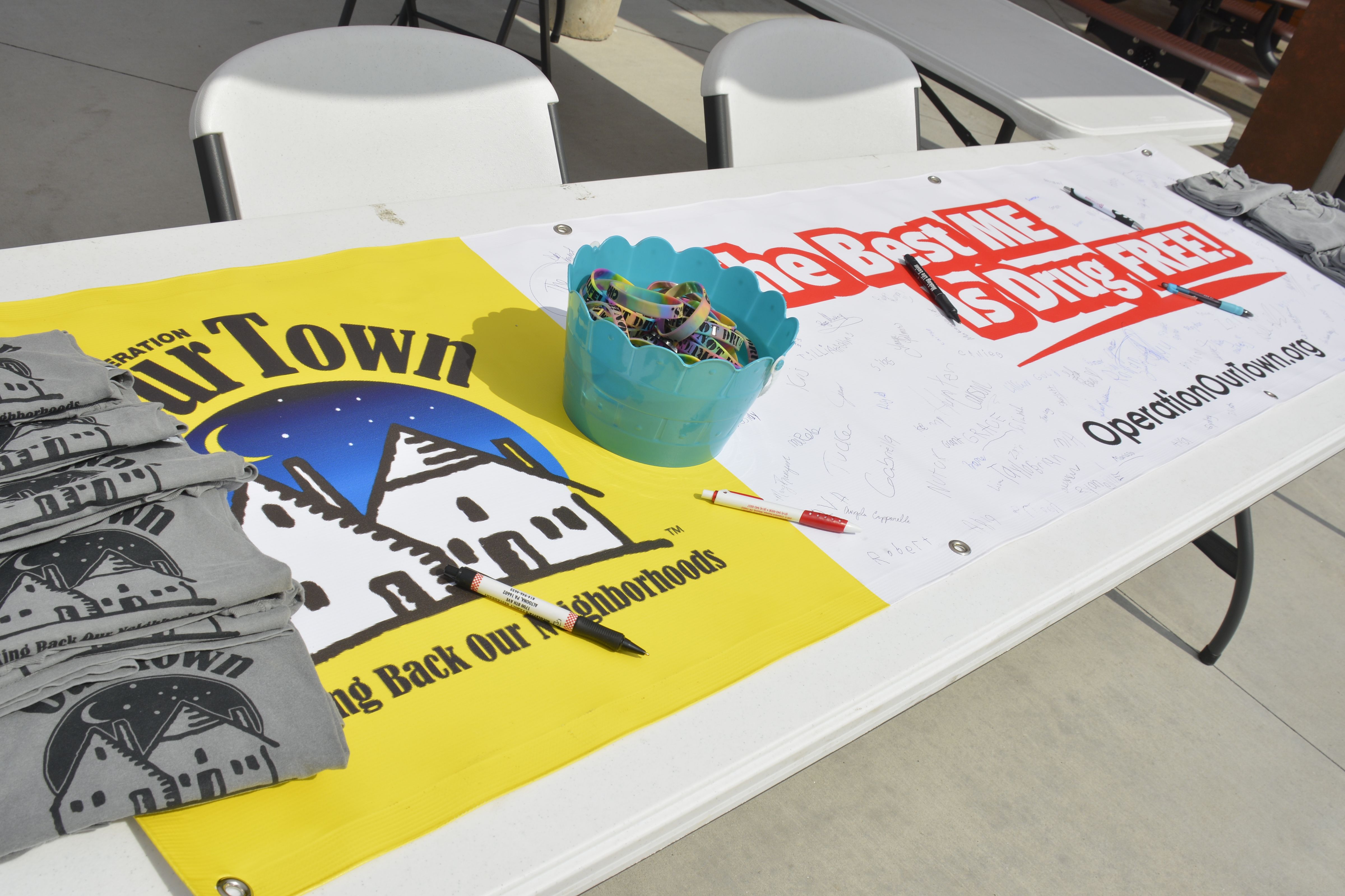 Image of Operation Our Town Shirts and Banner