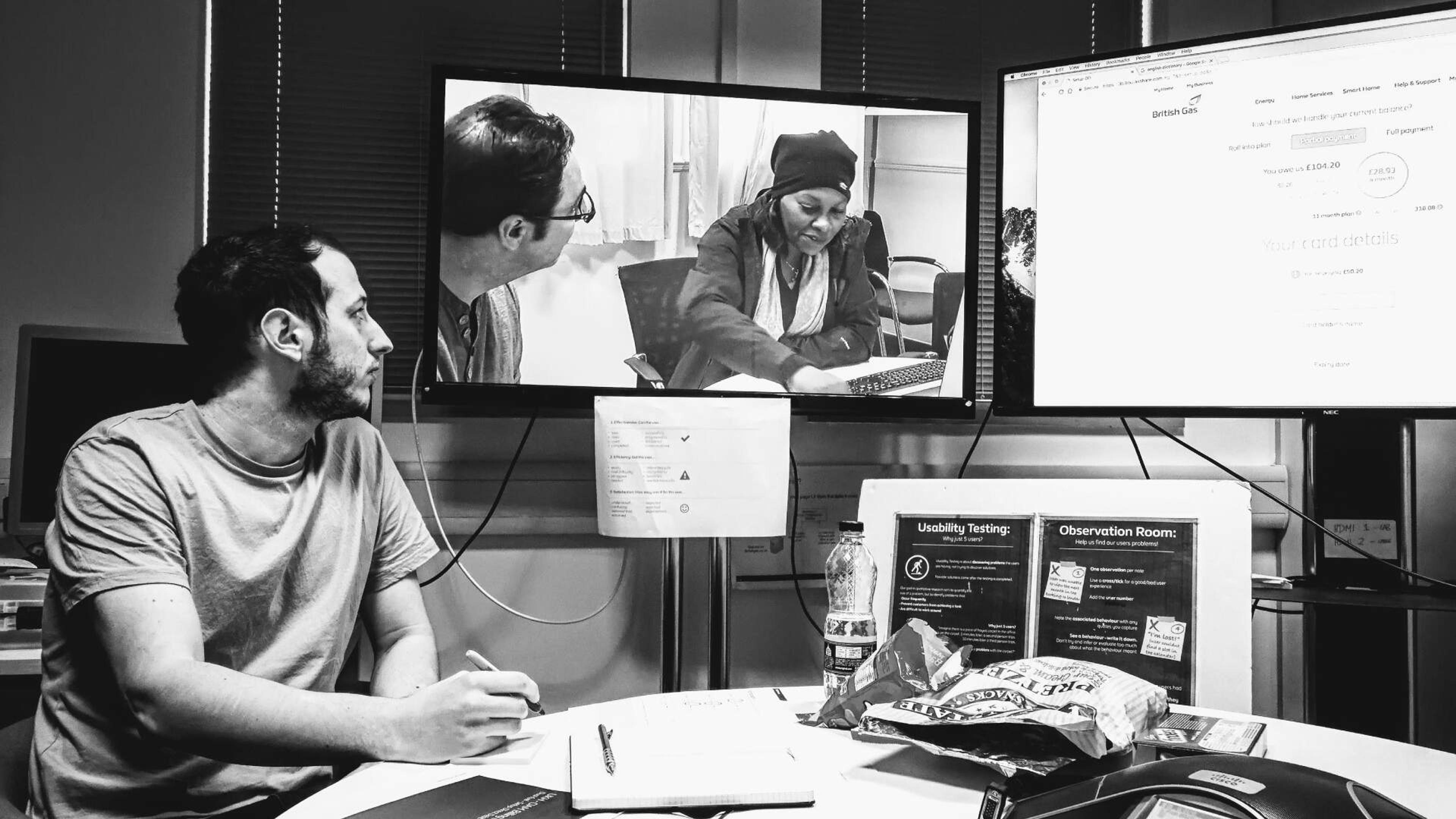 Our observation room showing a UX designer taking observational notes.