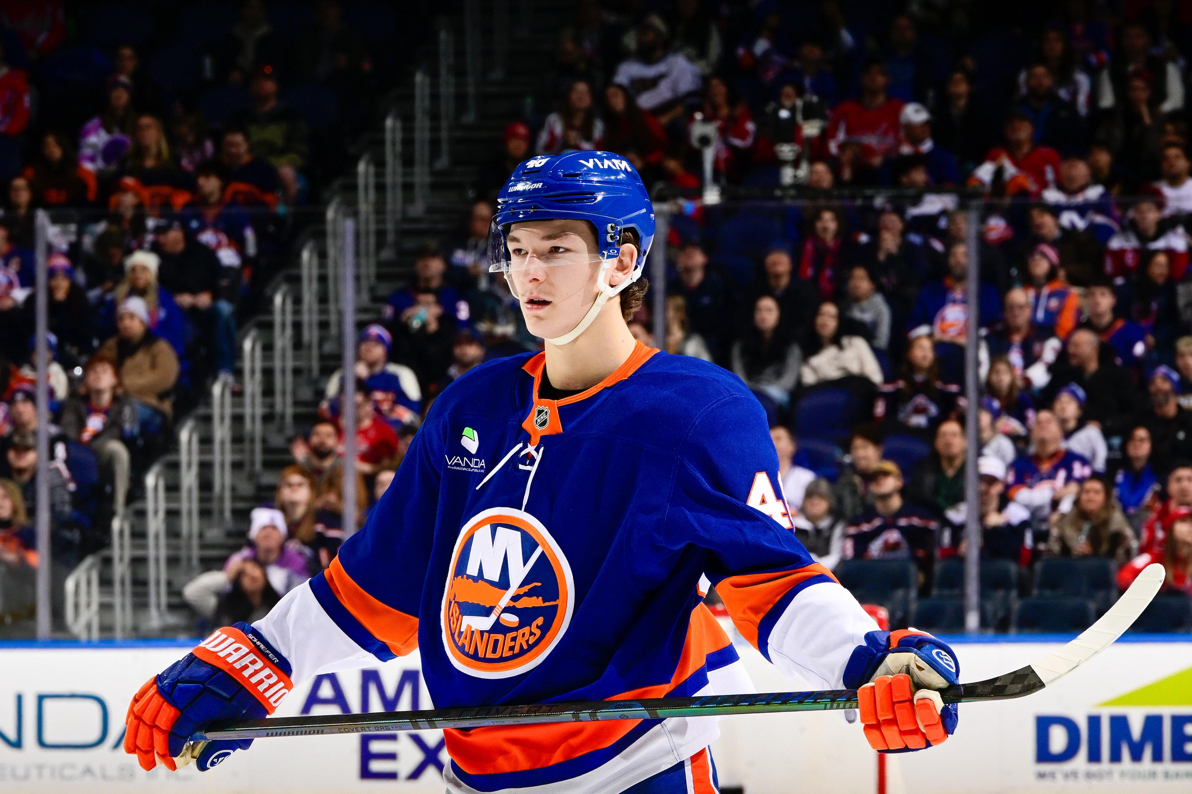 Matthew Schaefer of the New York Islanders signs on as Hockey Fights Cancer champion.