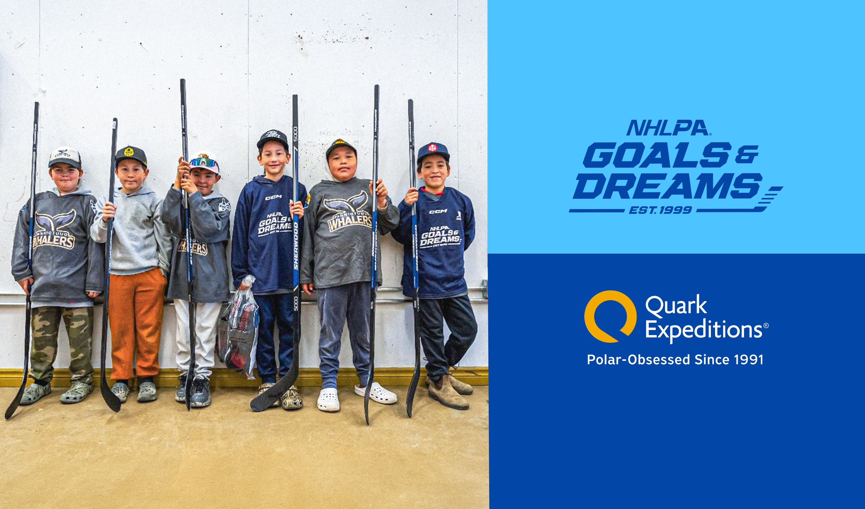 Six young boys holding hockey sticks, with NHLPA Goals & Dreams and Quark Expeditions logos.