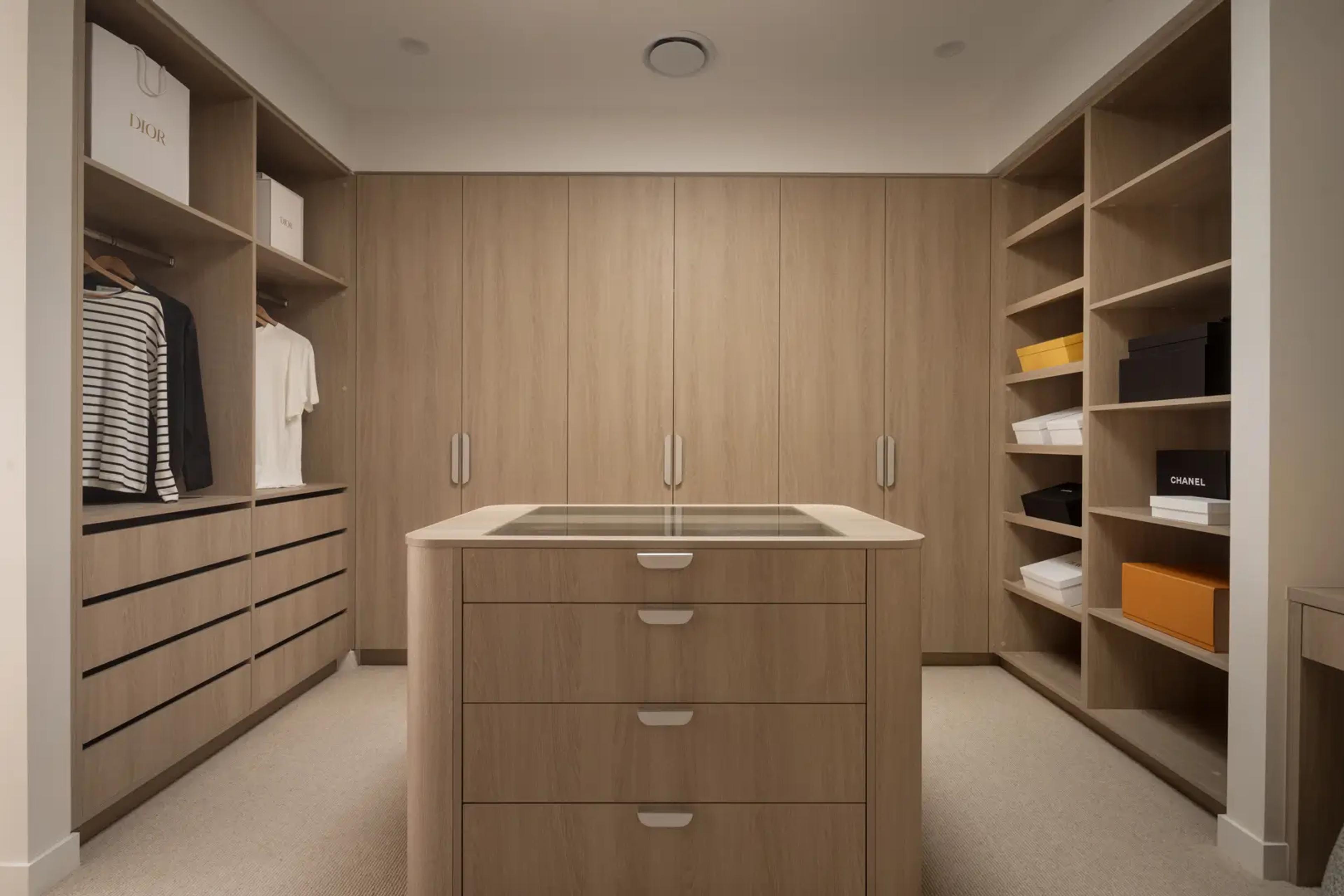 Walk in wardrobe with timber joinery and central island