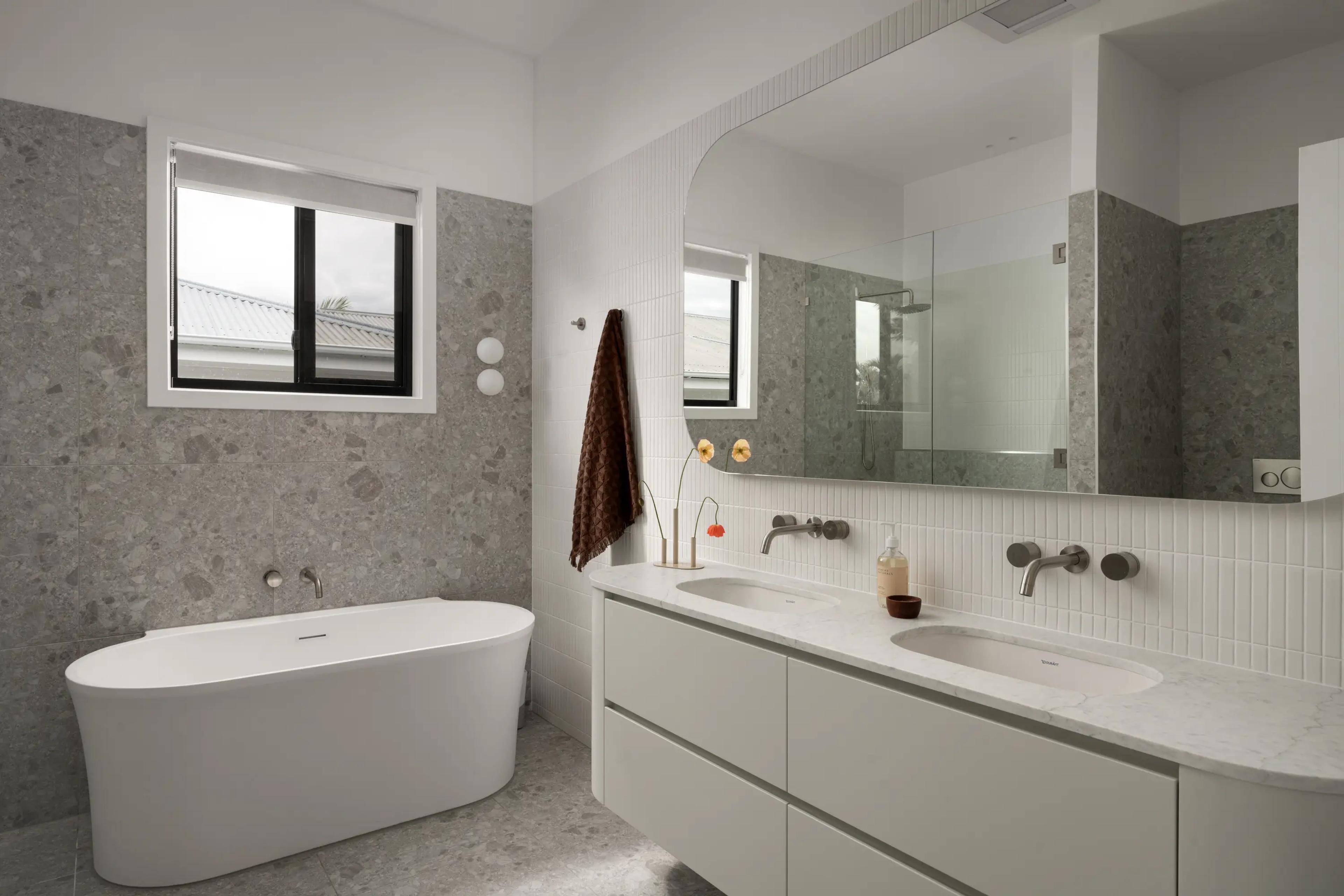 Luxury bathroom featuring durable stone, highlighting timeless interior design principles.