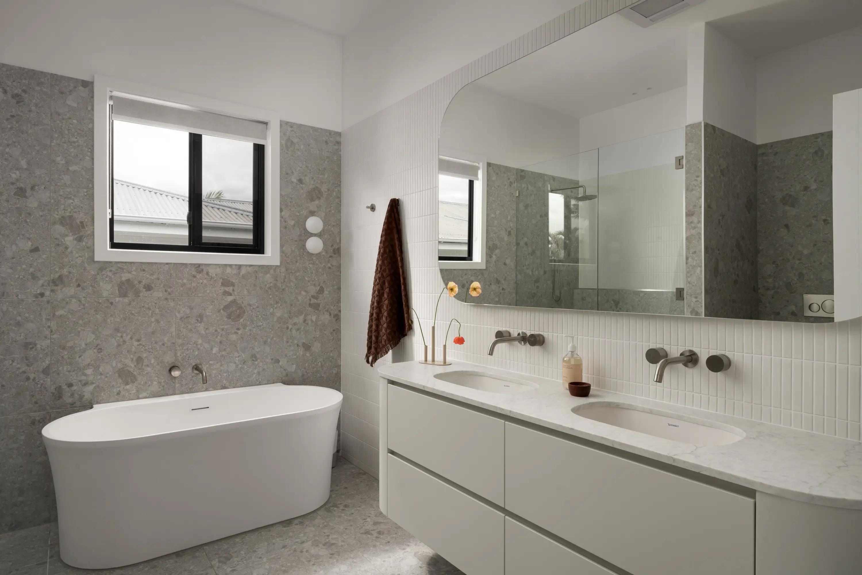 Luxury bathroom featuring durable stone, highlighting timeless interior design principles.