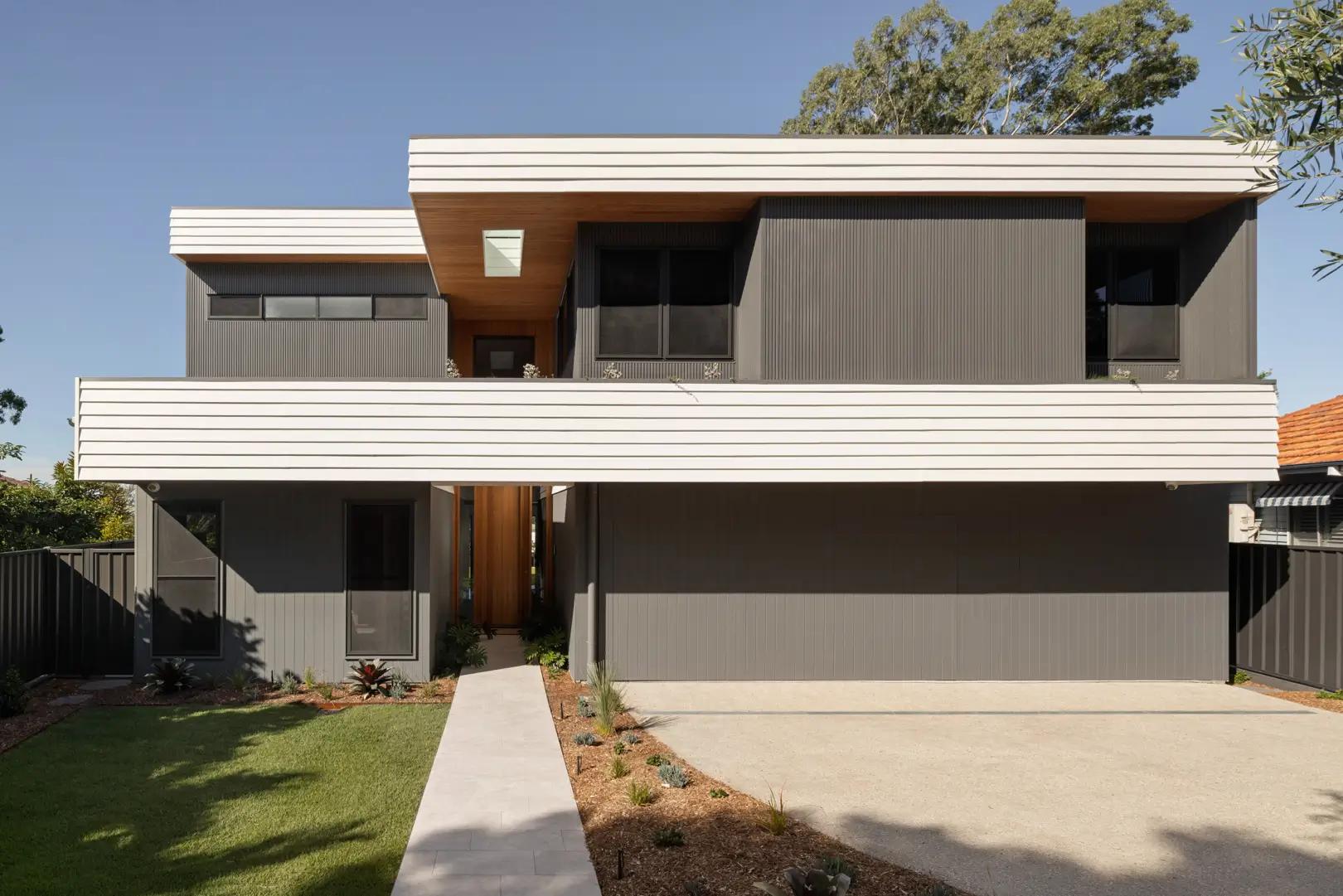 Street facing facade with driveway and entry path