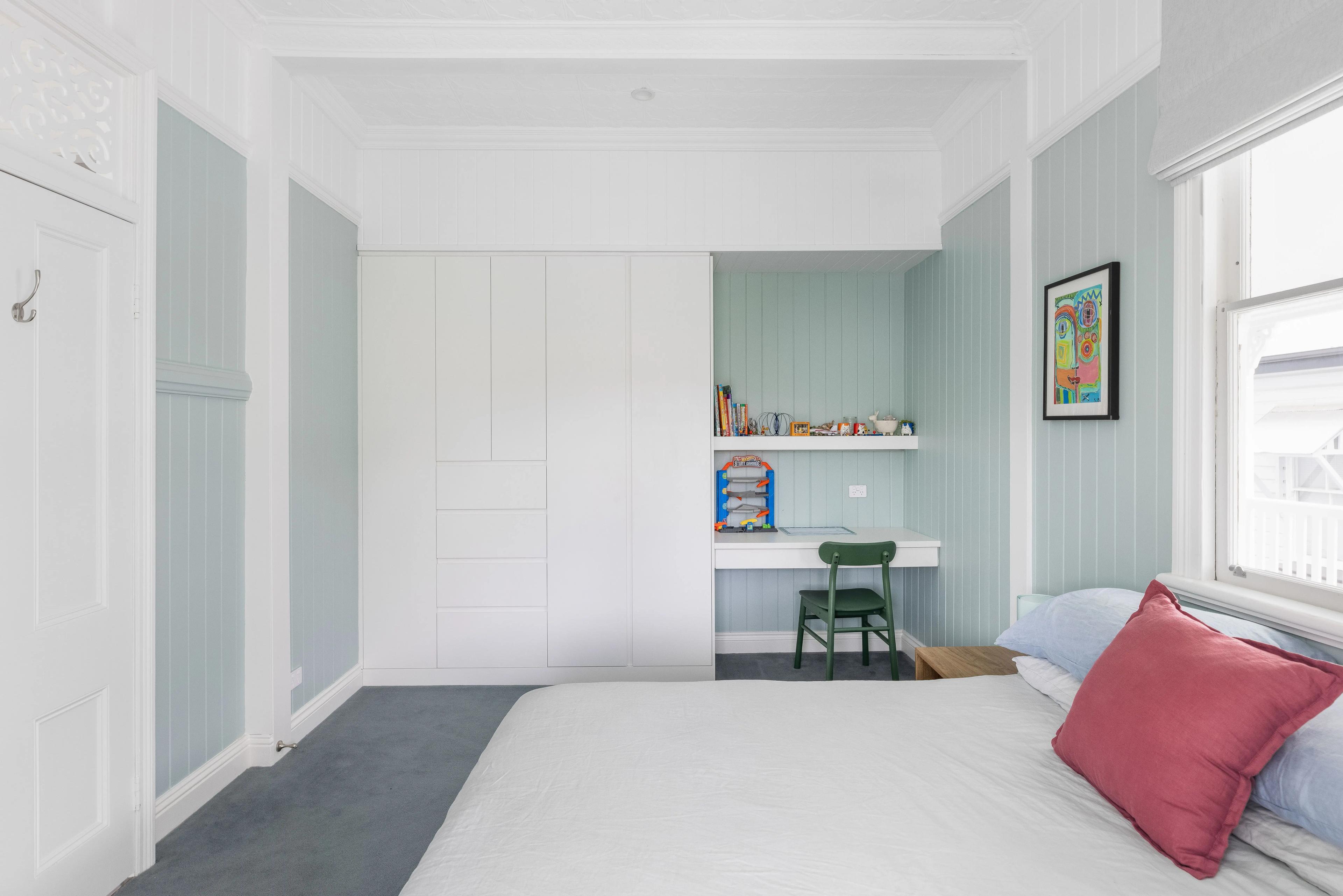 Children's bedroom with built in wardrobe and study nook