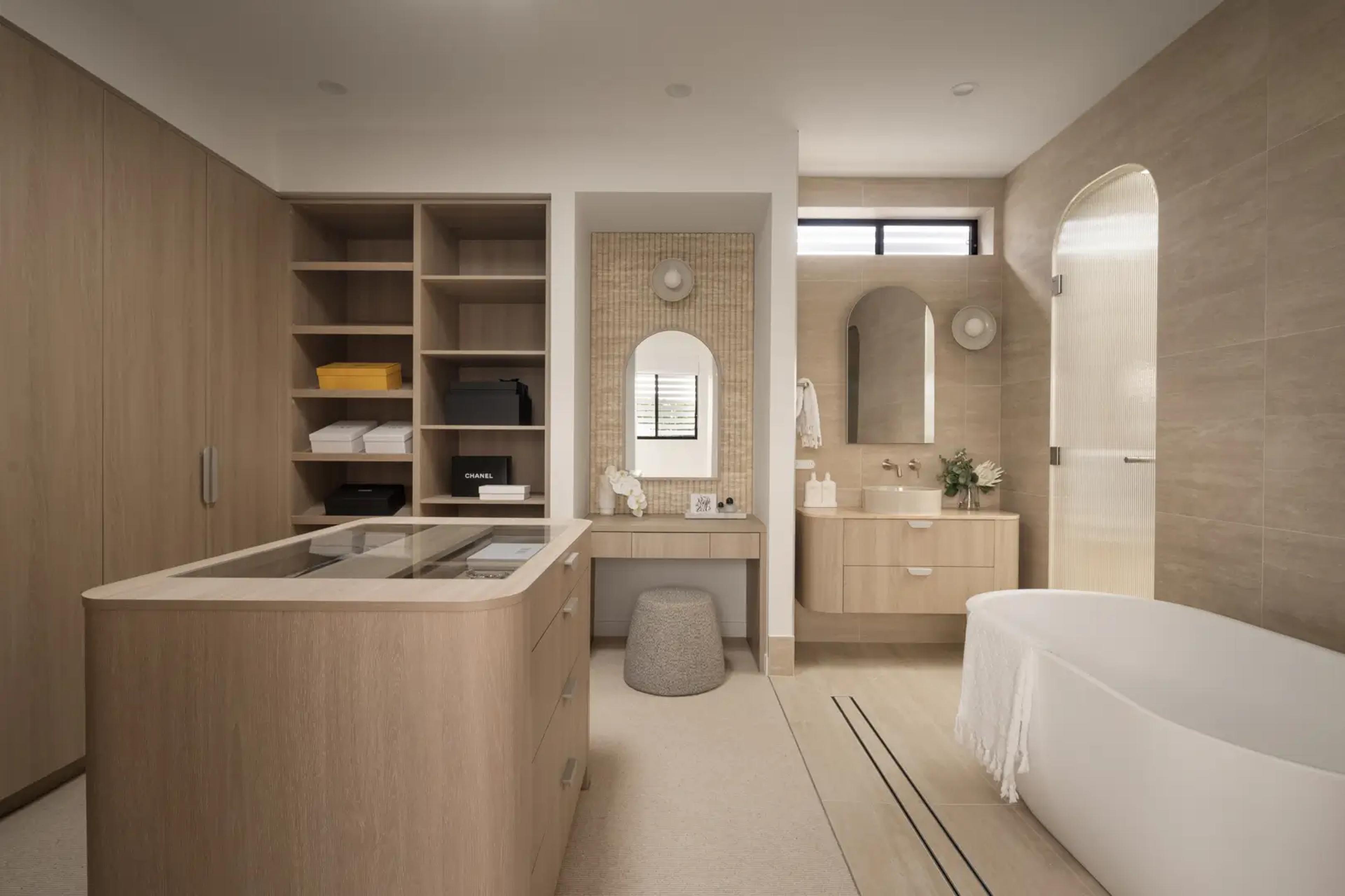 Dressing room and ensuite with island and freestanding bath