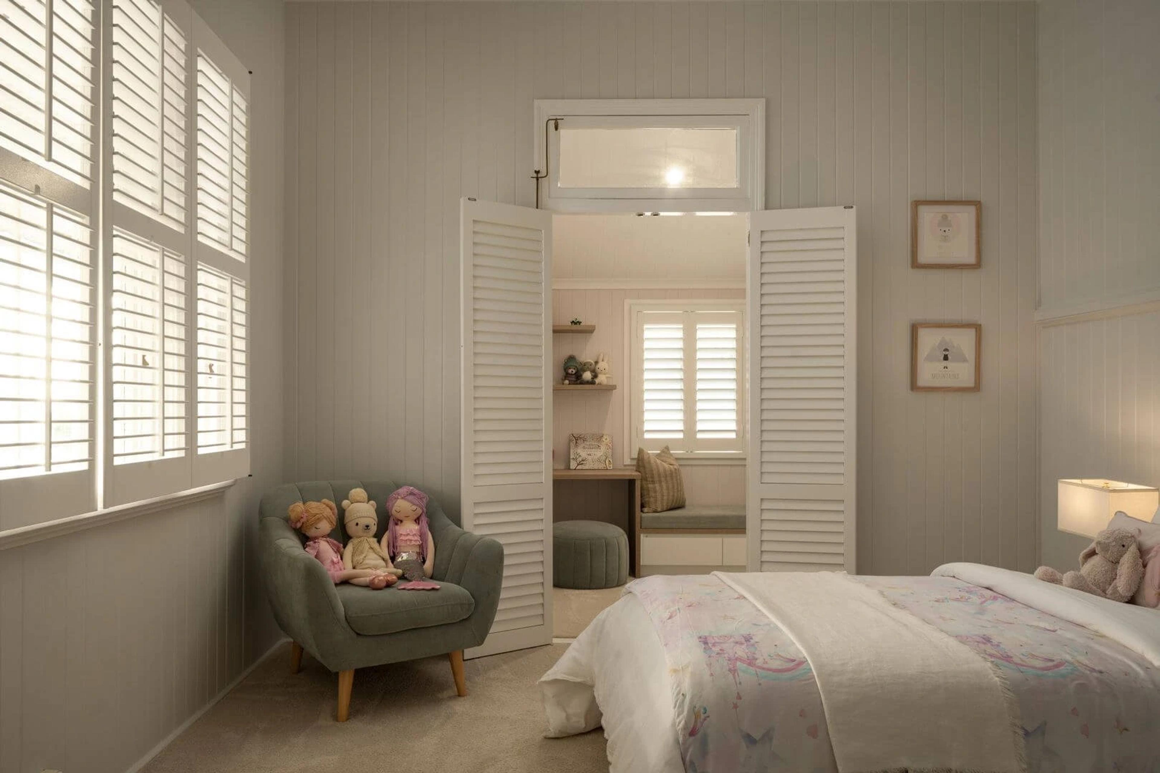 Child's bedroom with plantation shutters and built in study nook