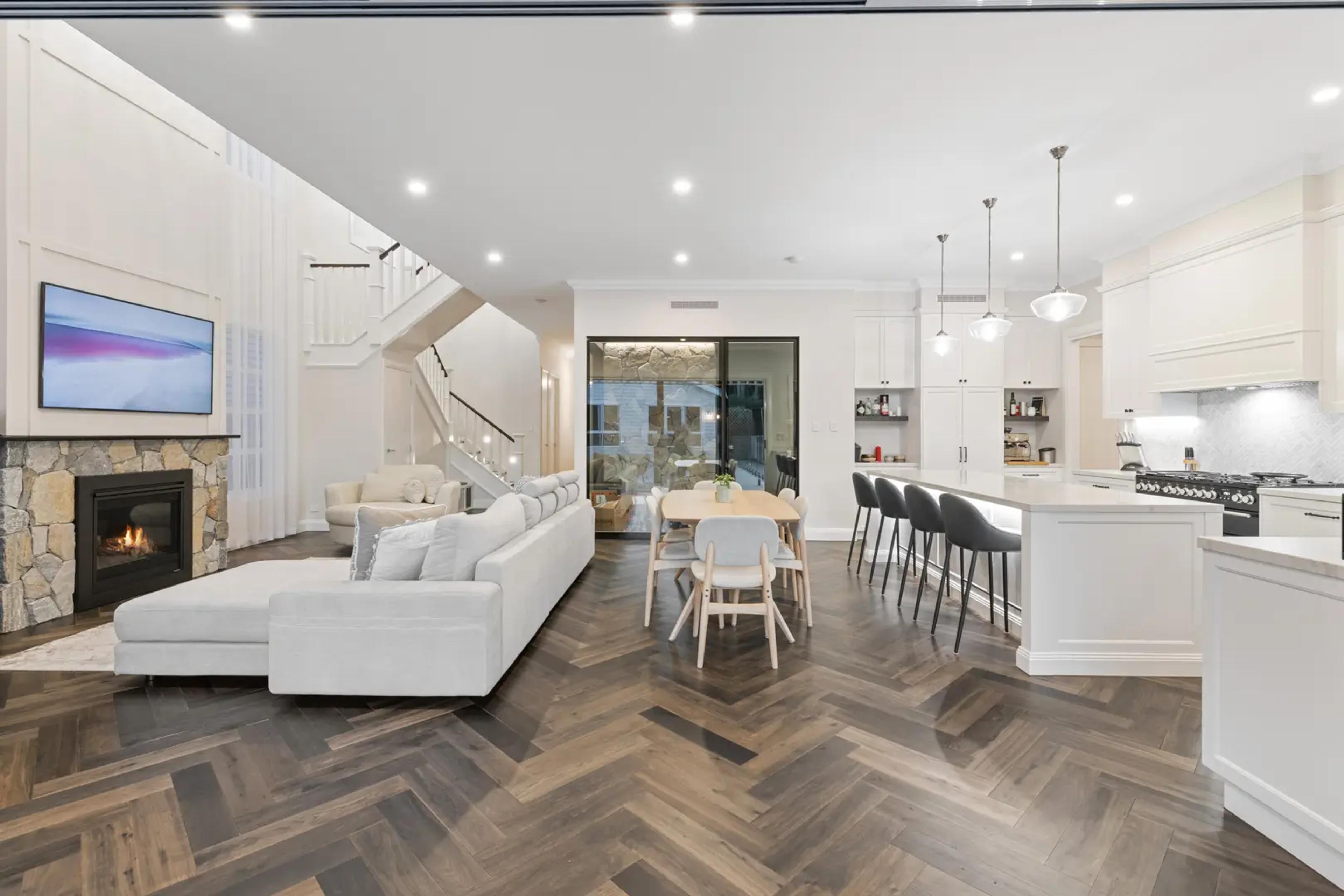 Open plan living, dining and kitchen with herringbone floor