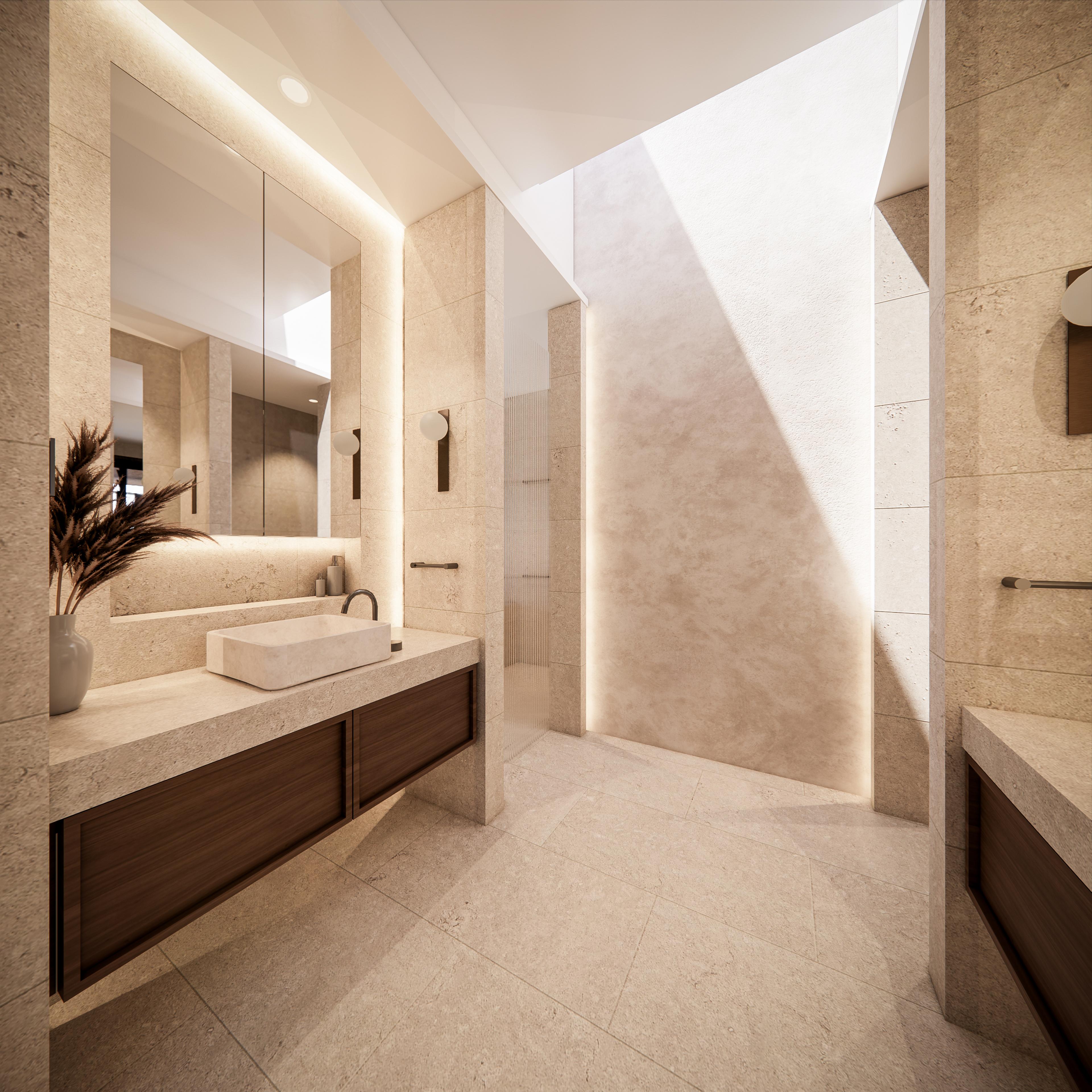 Travertine master ensuite with stone vanity, backlit mirror, fluted glass screen and a bright skylit shower