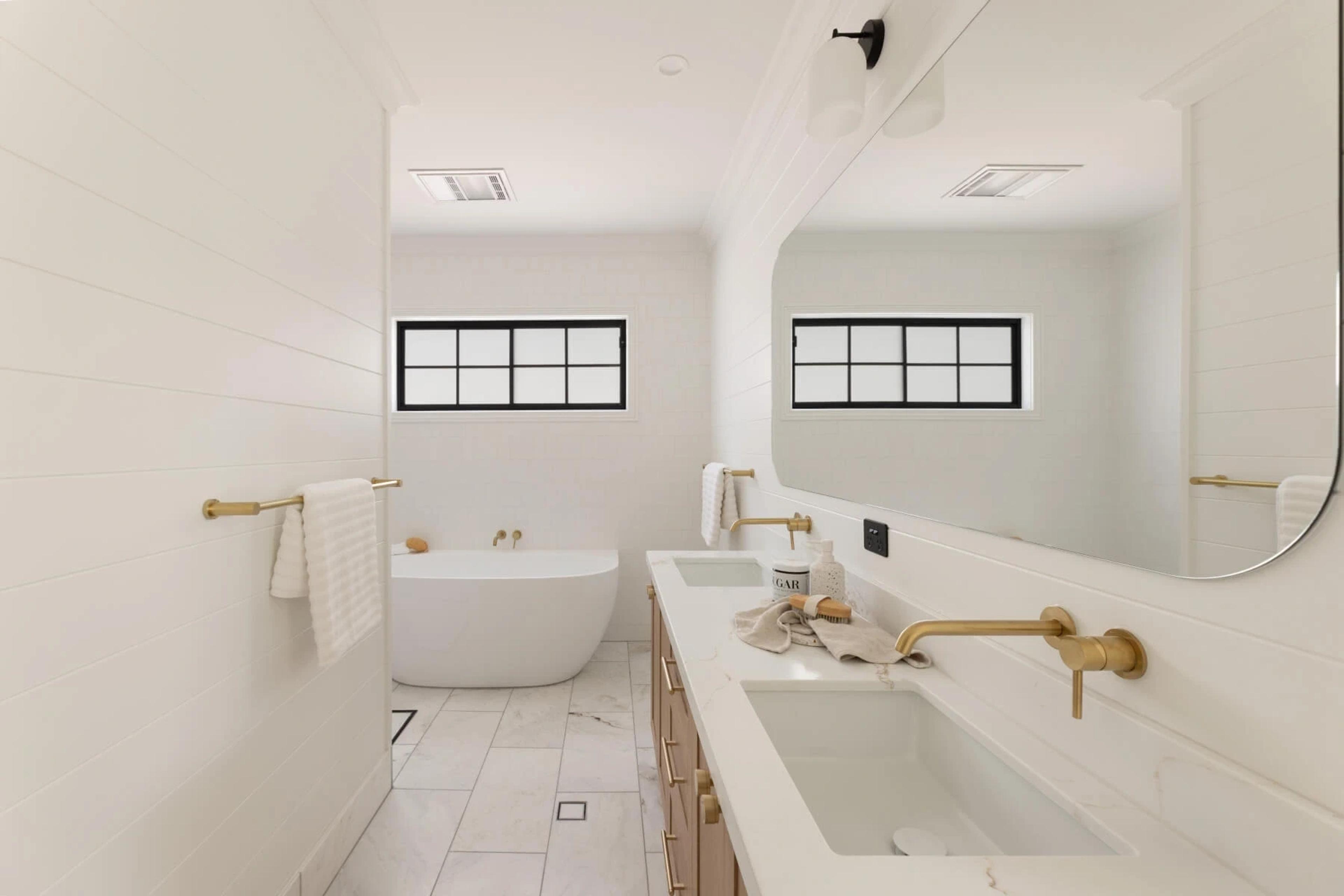 Bathroom with freestanding bath, double vanity and brass tapware