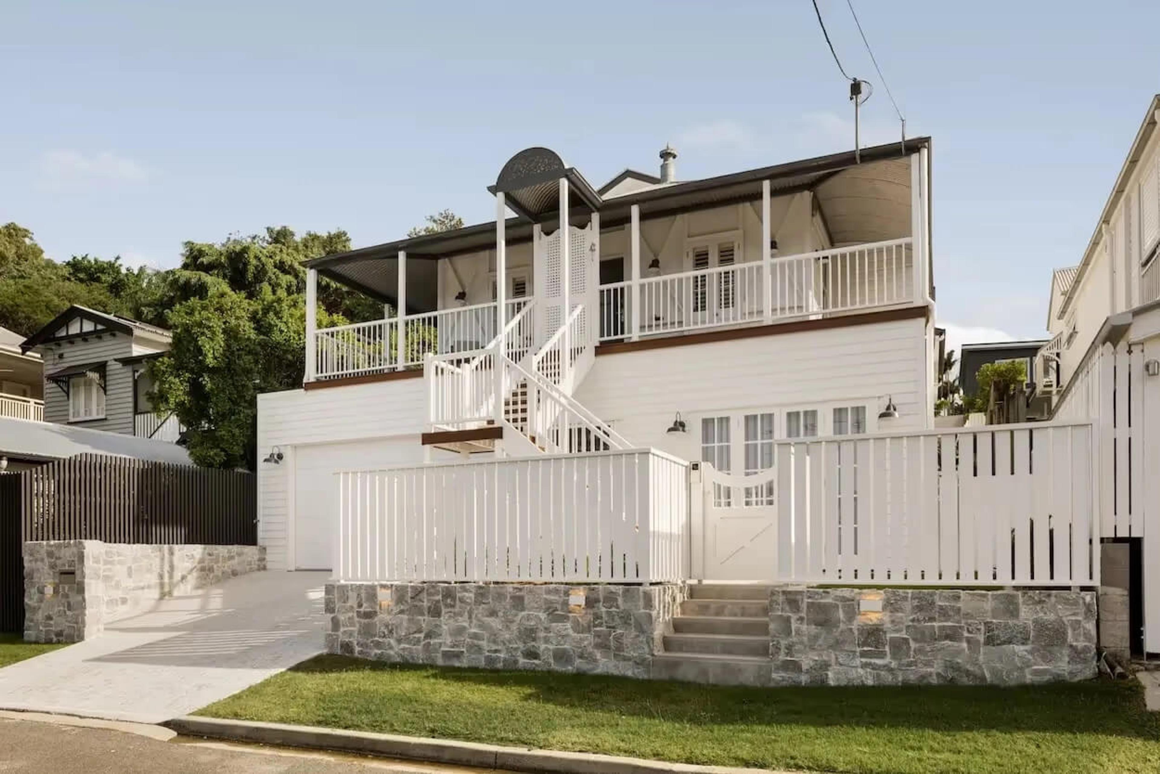 A Brisbane Queenslander raised with a new lower level built underneath, by Invilla Architecture