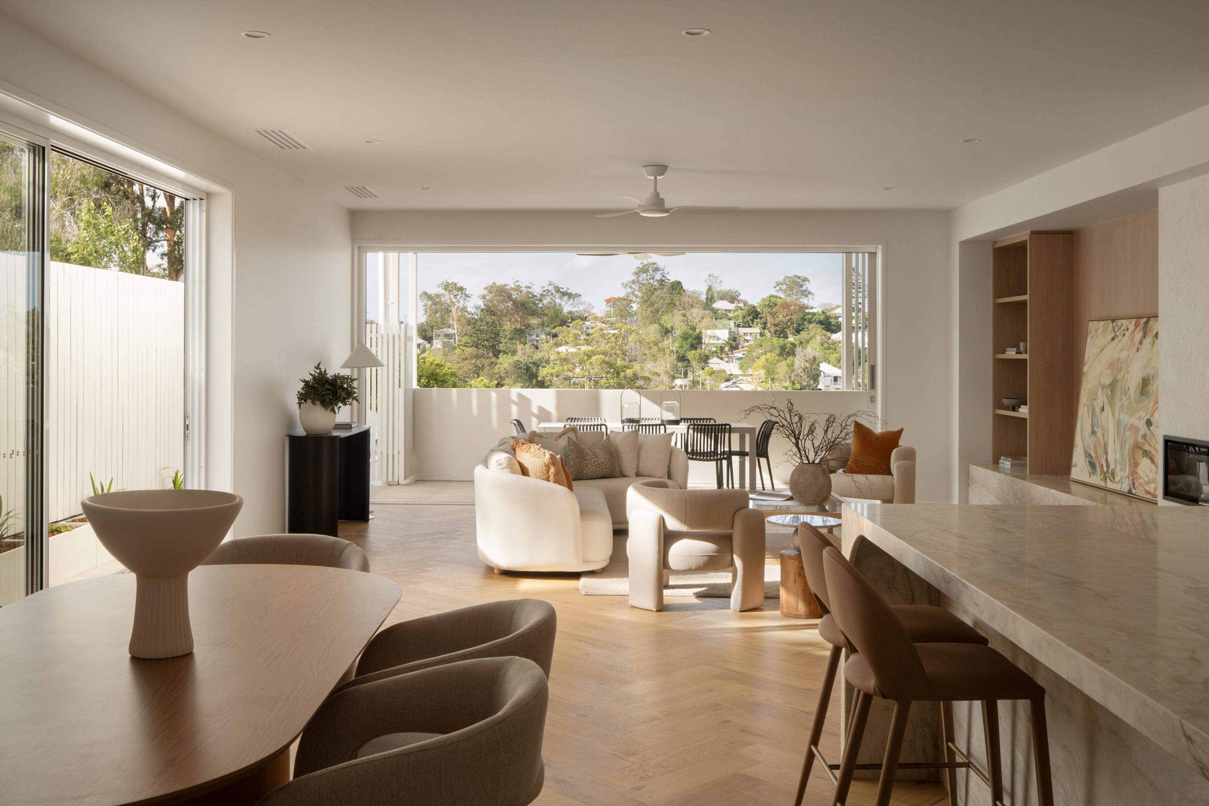Open dining and living area with elevated suburb views
