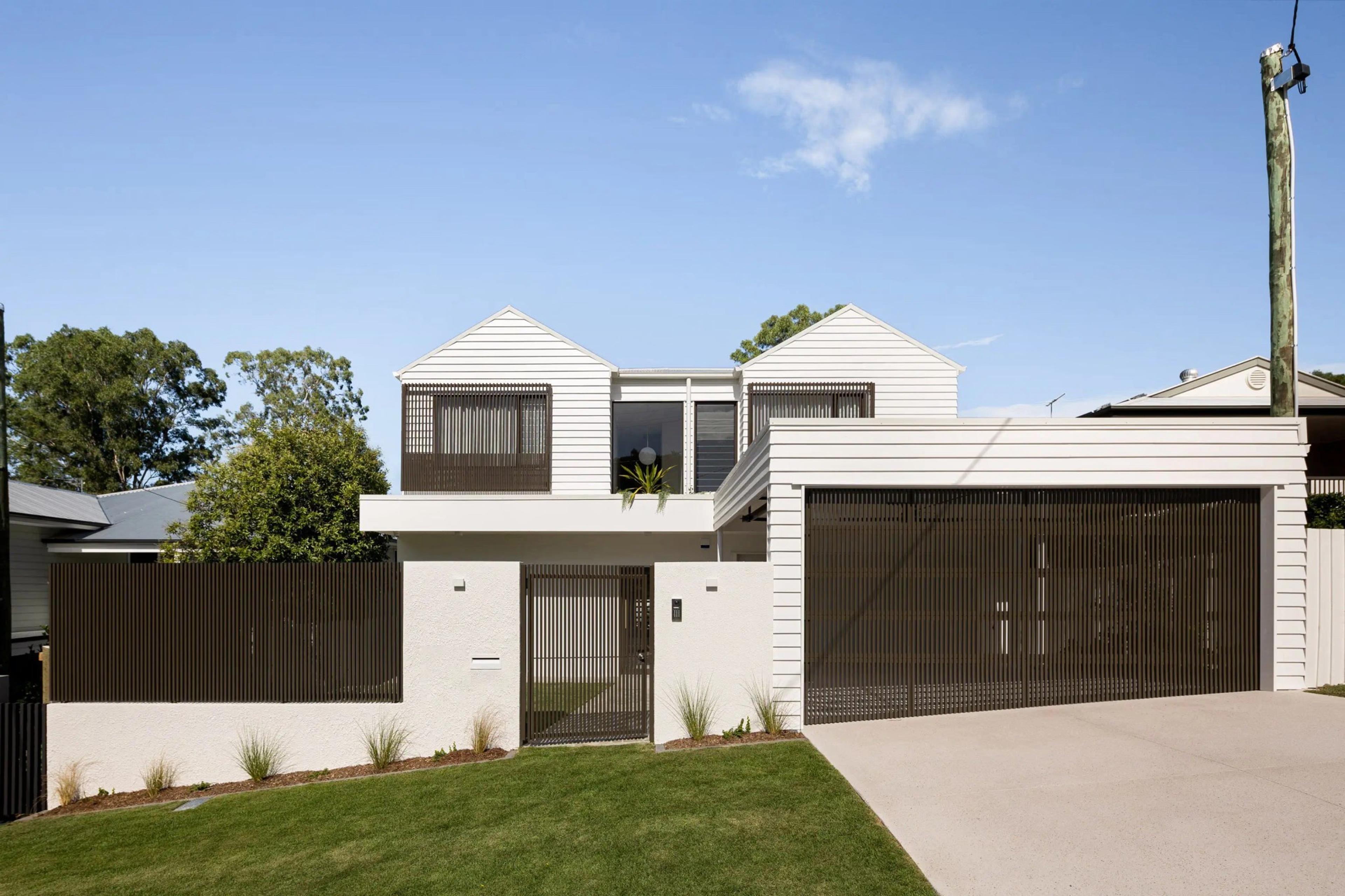 Street facing facade with weatherboard cladding, garage and front gate