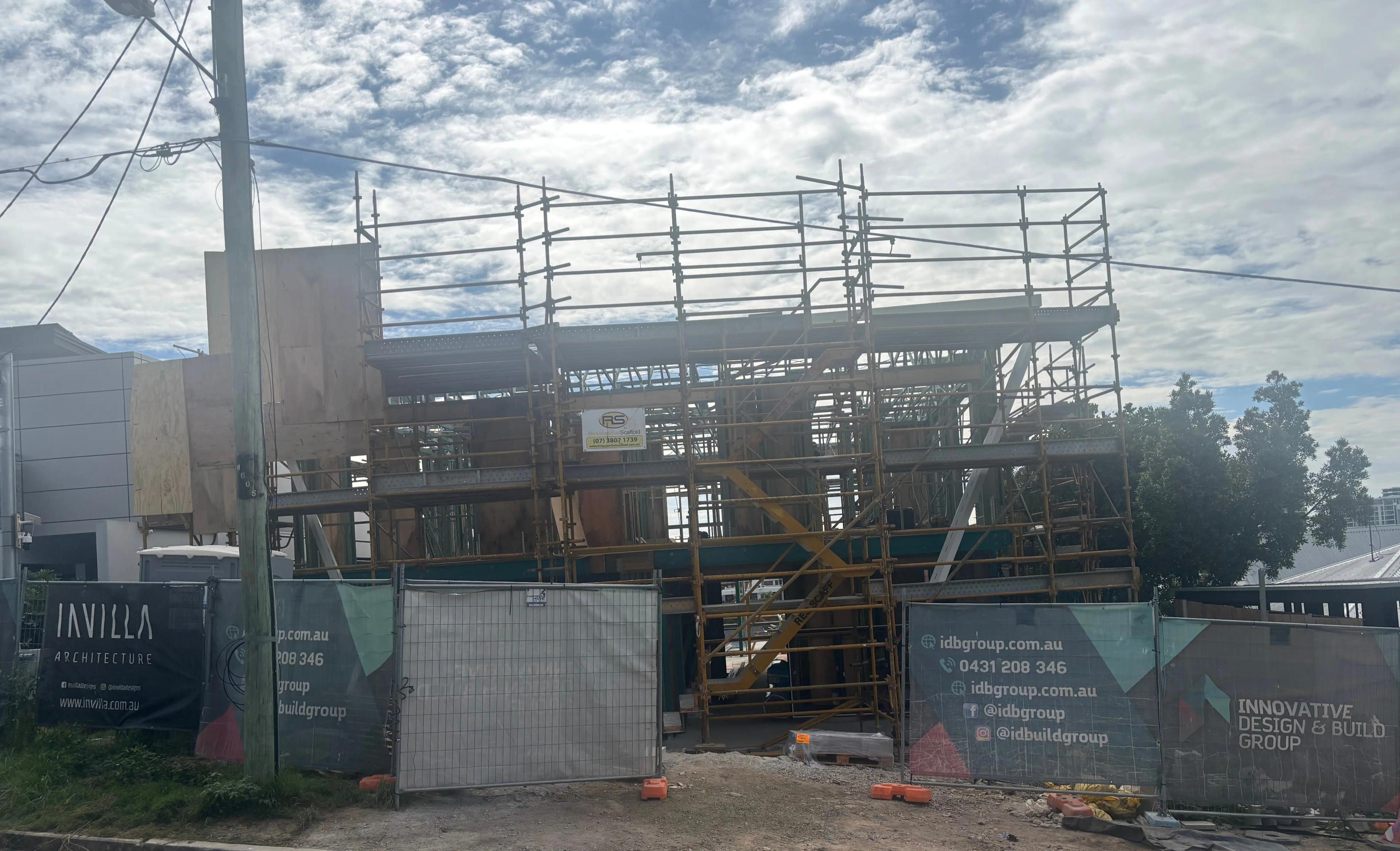 Residential construction site with Invilla Architecture signage