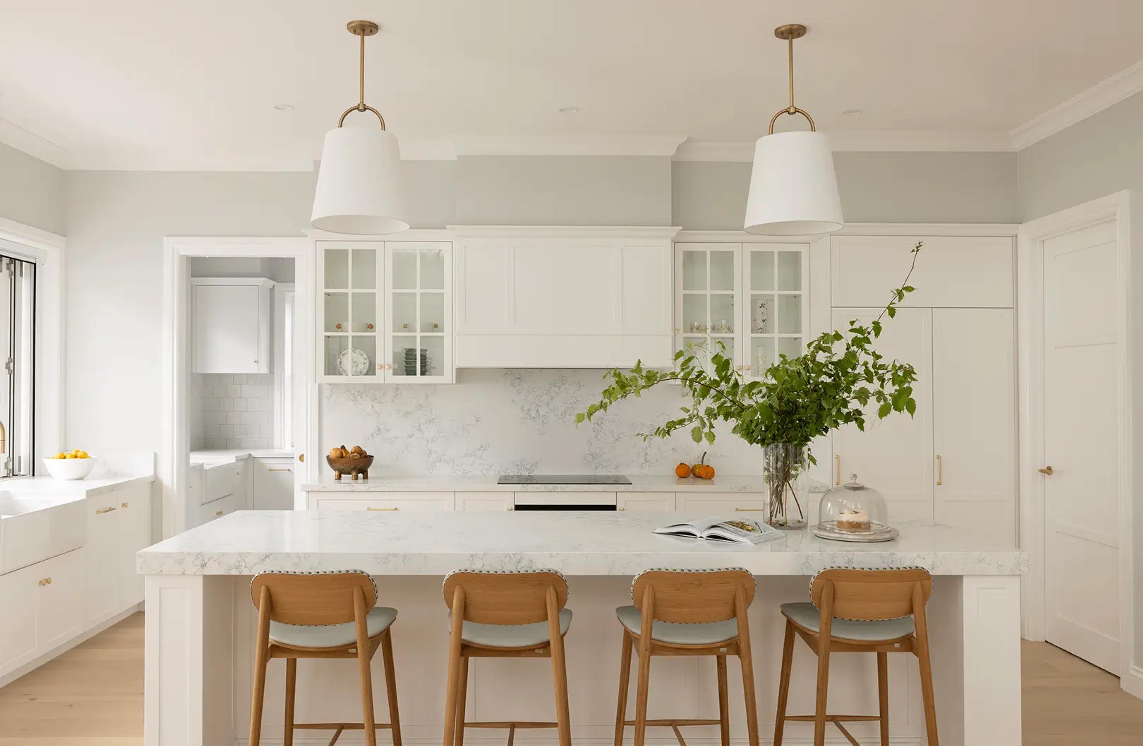 Kitchen with marble island and timber bar stools