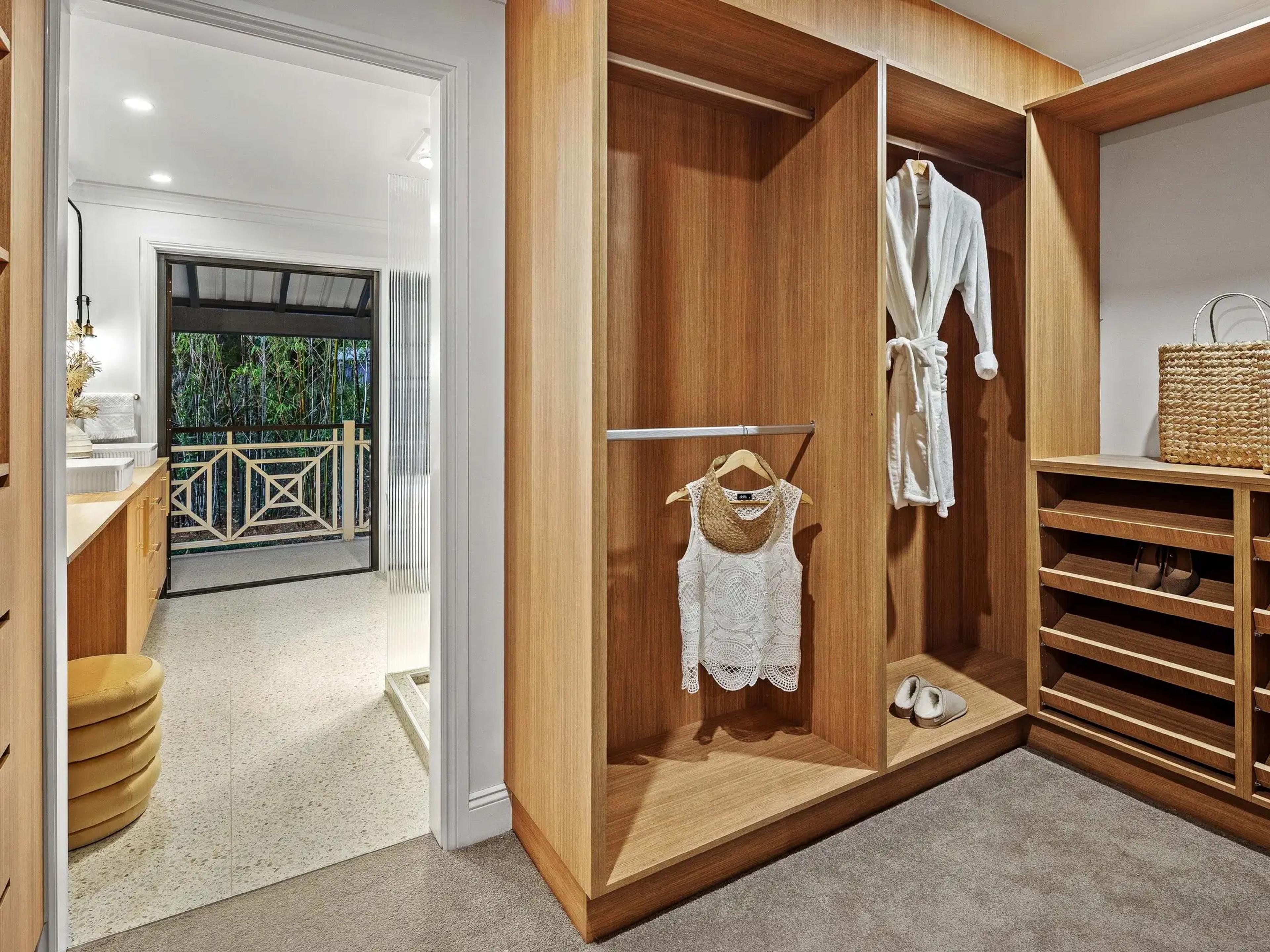 Timber walk in wardrobe with hanging space and shelving