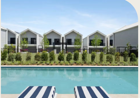 Elevation of two storey townhouses with pool in the forefront