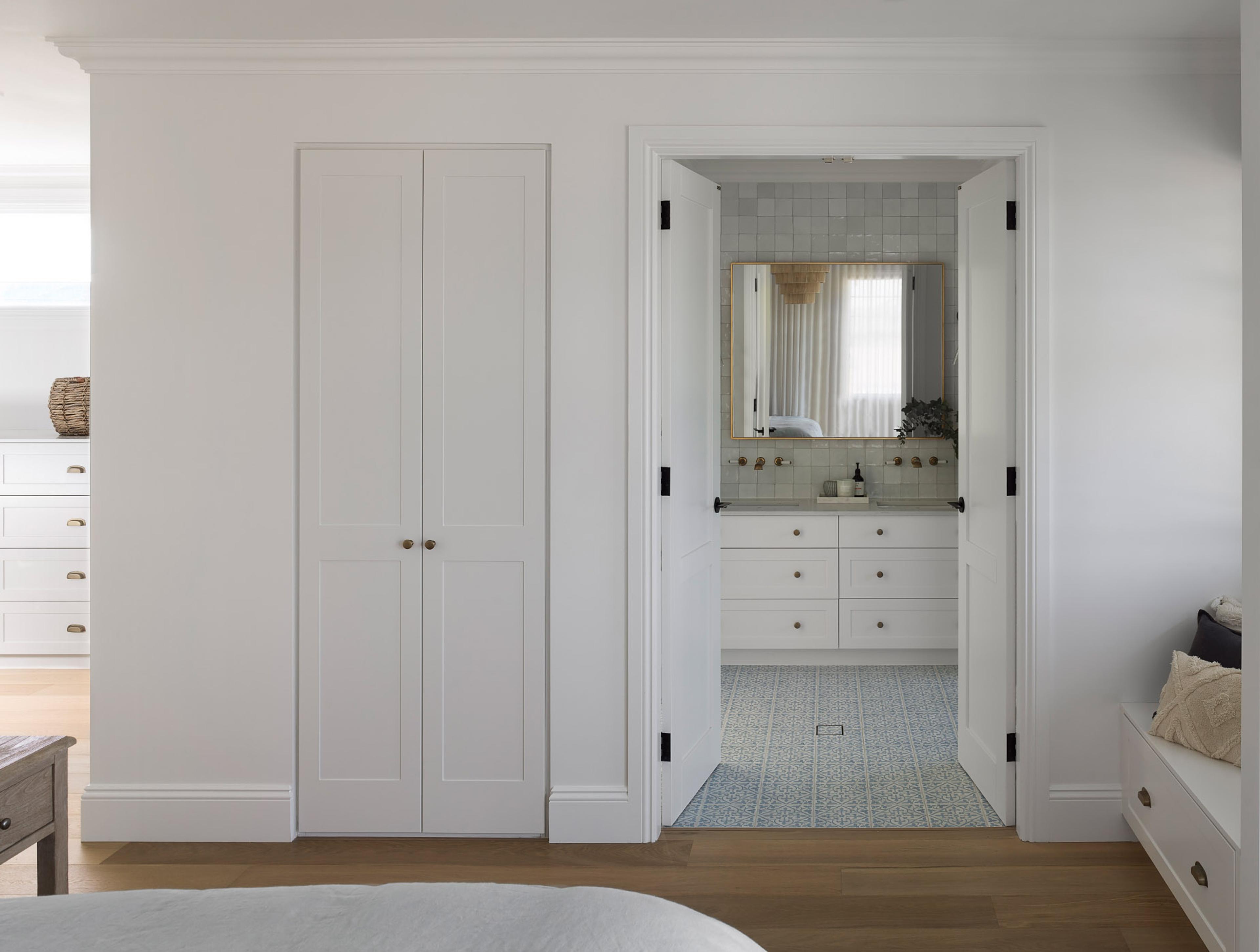 Bedroom doorway looking through to tiled ensuite vanity