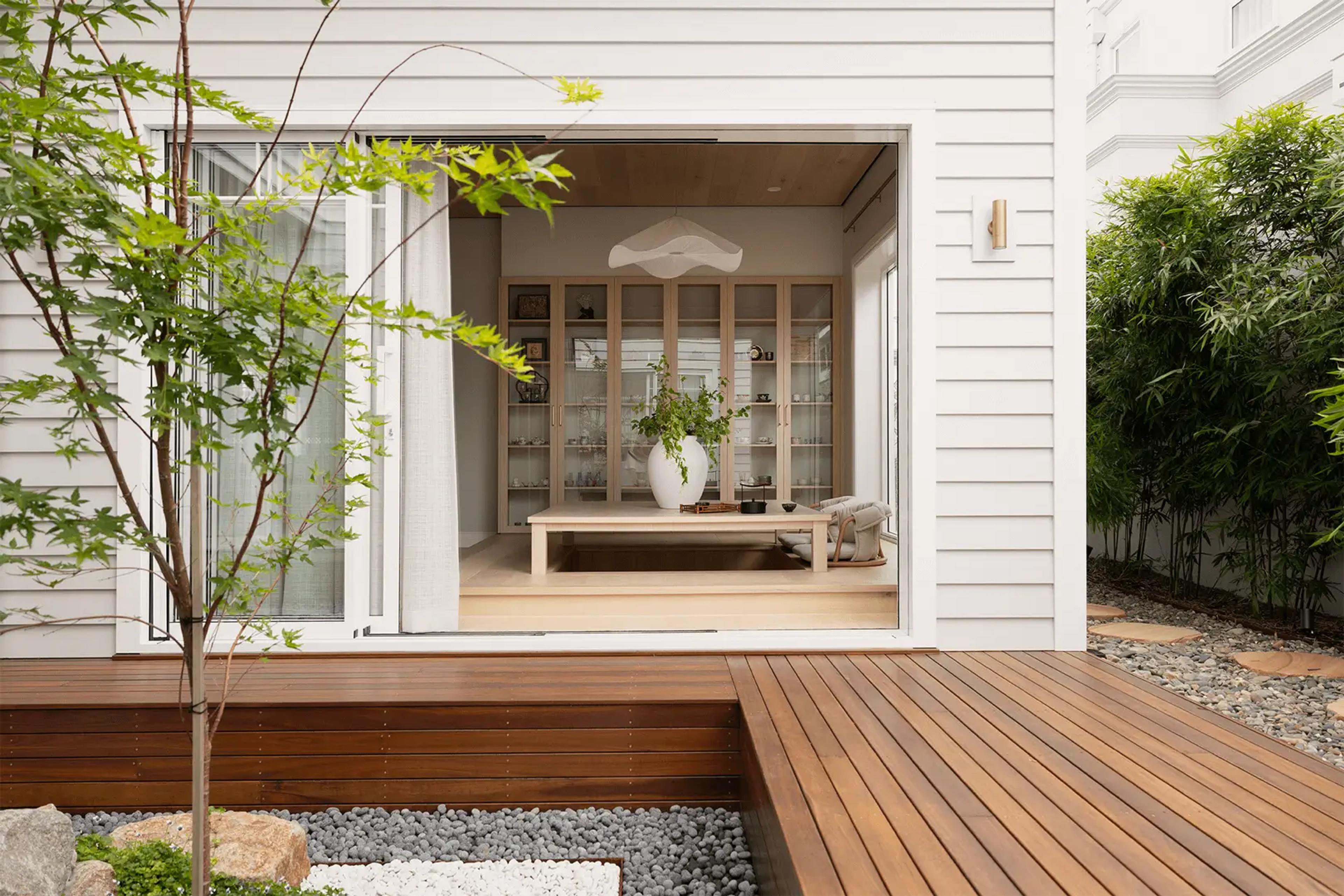 Tea room viewed across timber deck and pebble garden