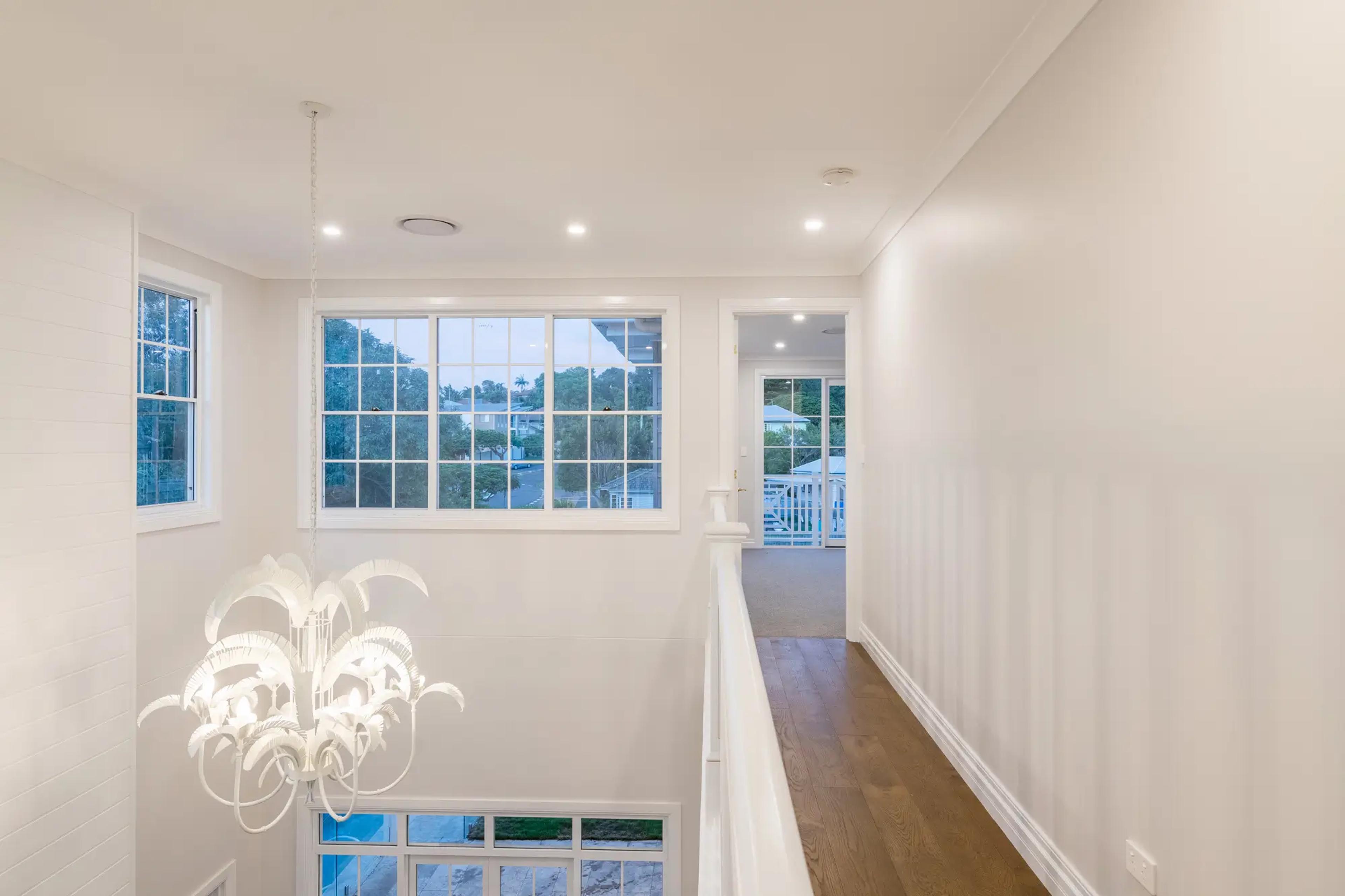 Upstairs hallway with window and timber floors