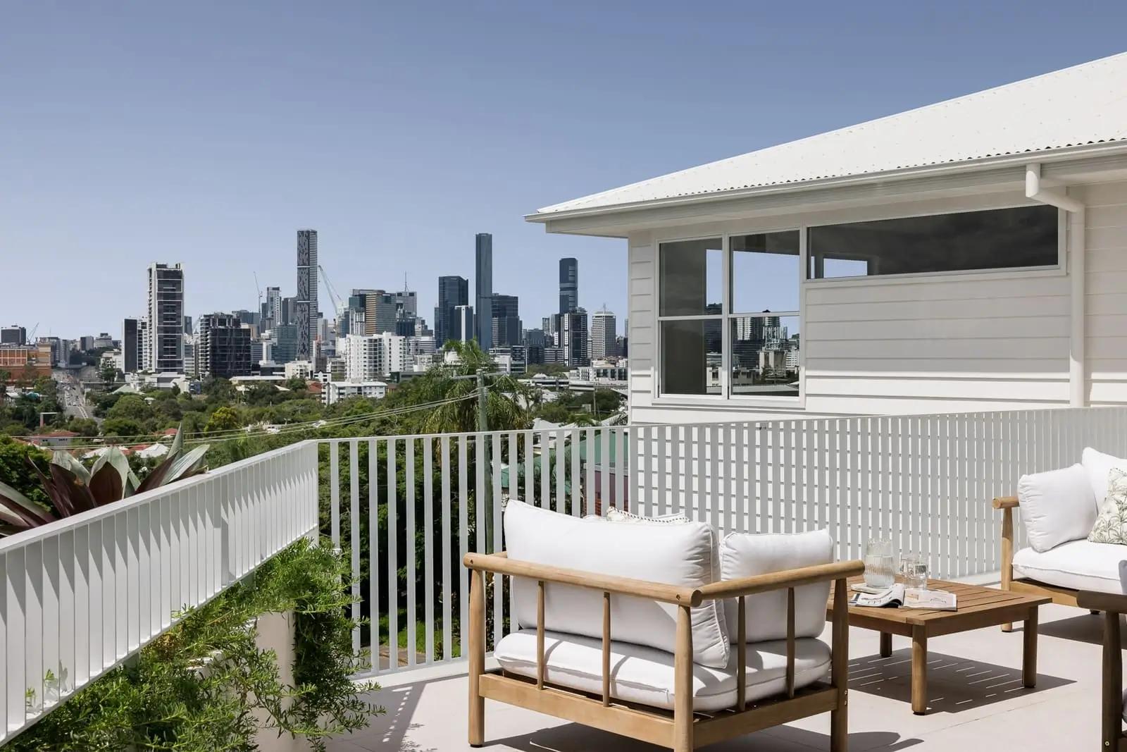 Outdoor entertaining area with panoramic Brisbane city skyline views