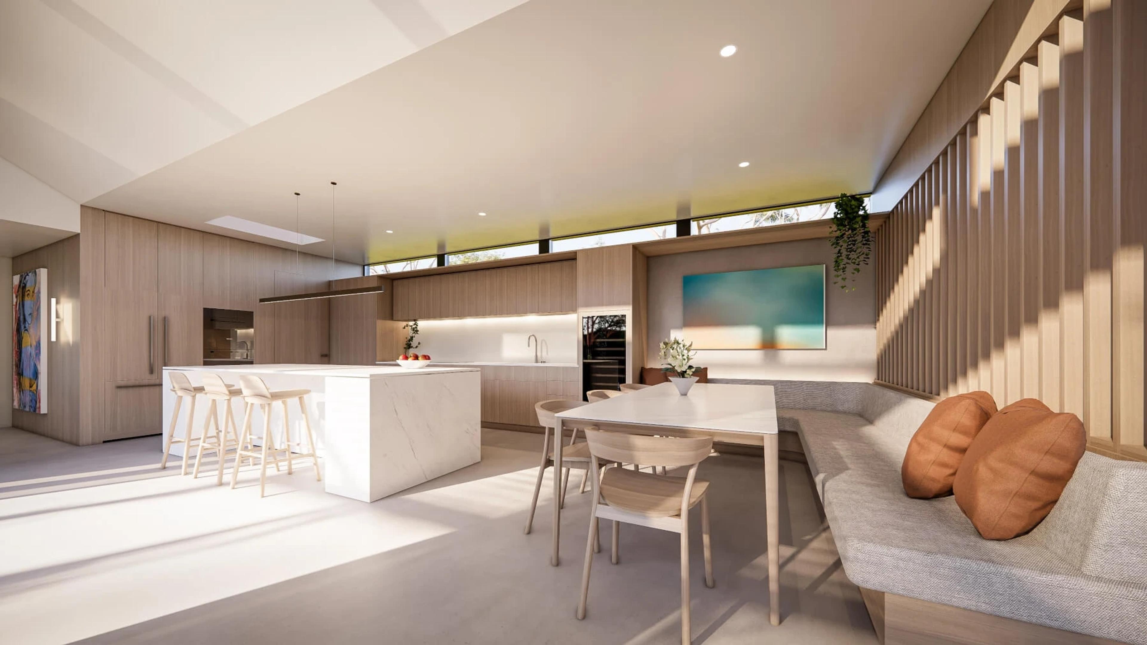 Open kitchen and dining area with marble island and banquette seating