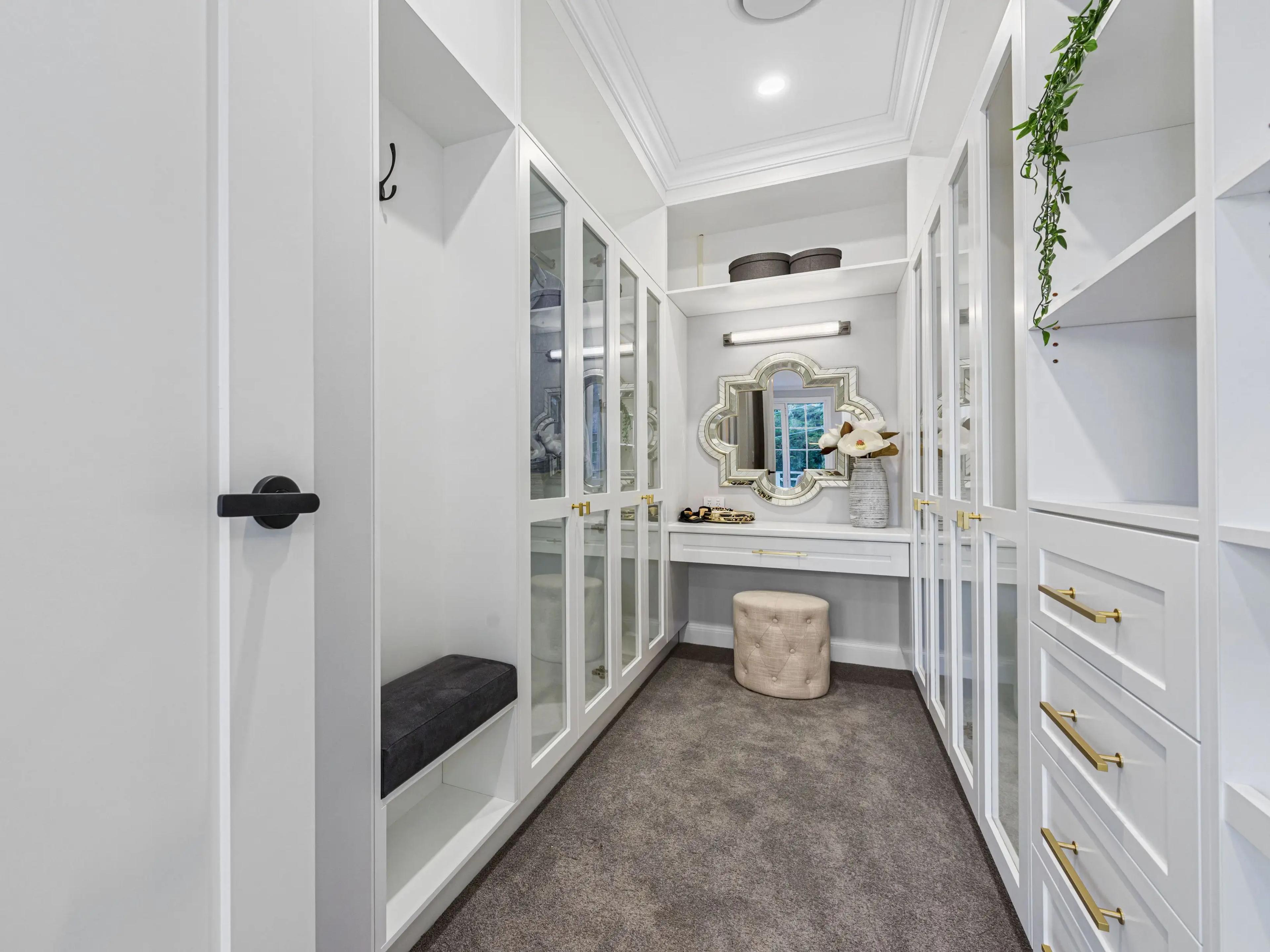 Walk in wardrobe with joinery and dressing table