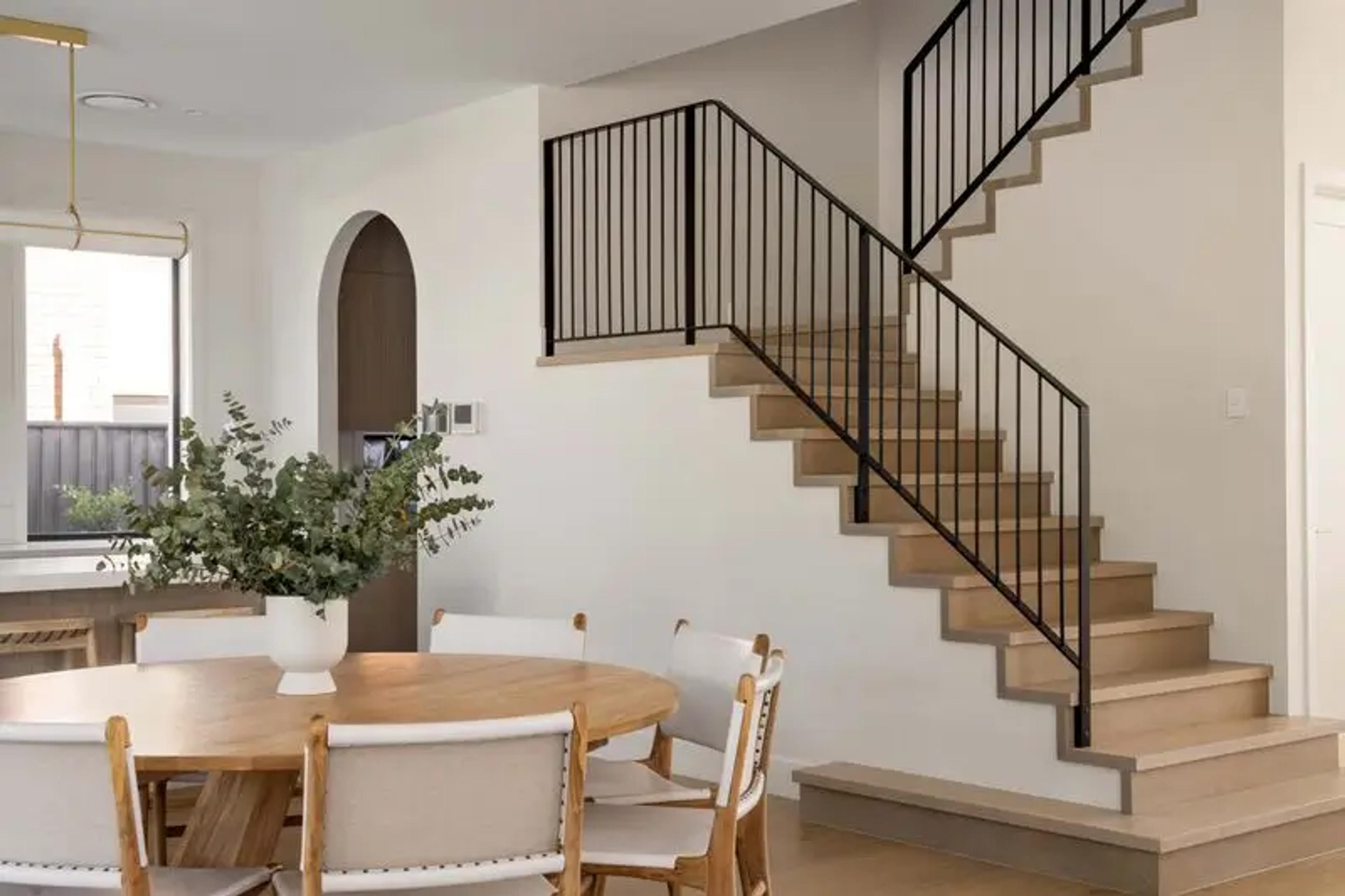 Open plan dining and modern timber staircase
