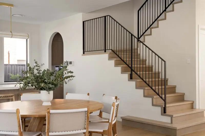Open plan dining and modern timber staircase