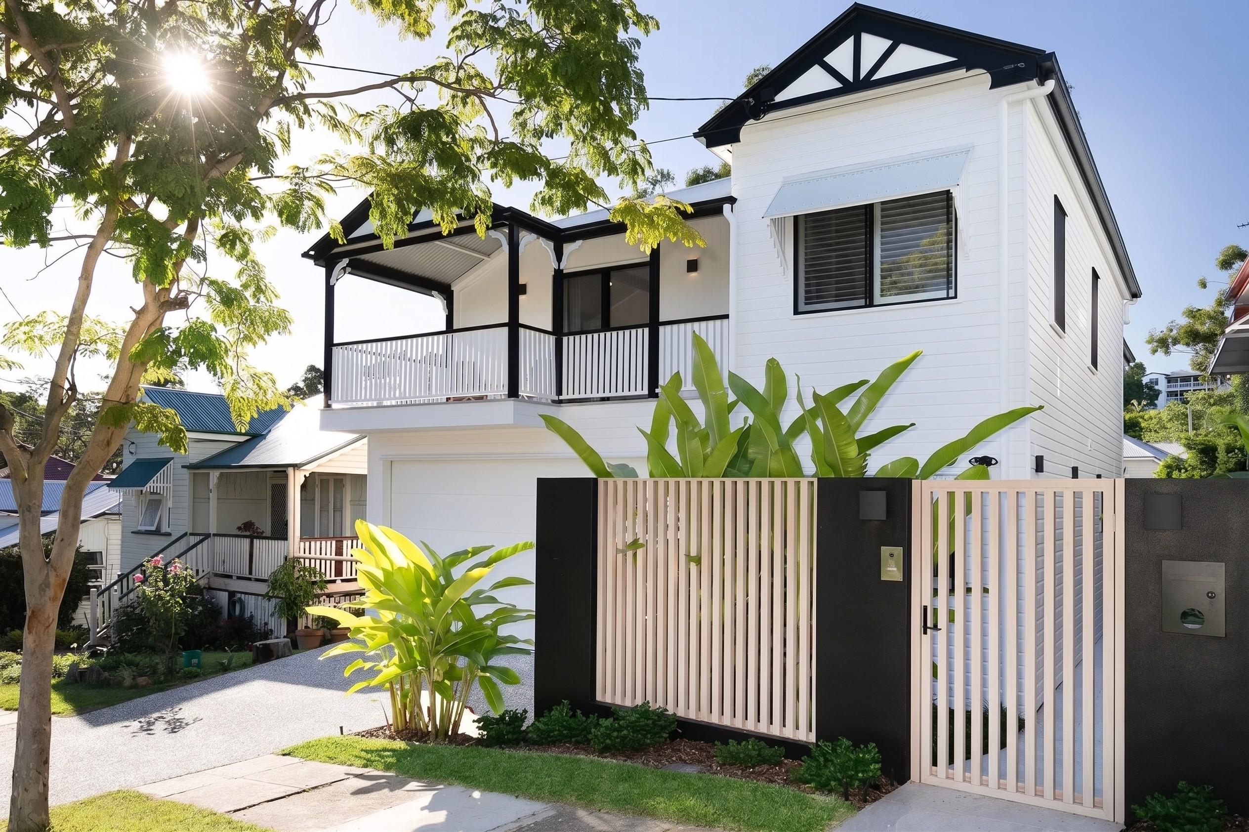 White two storey Queenslander home viewed from the street
