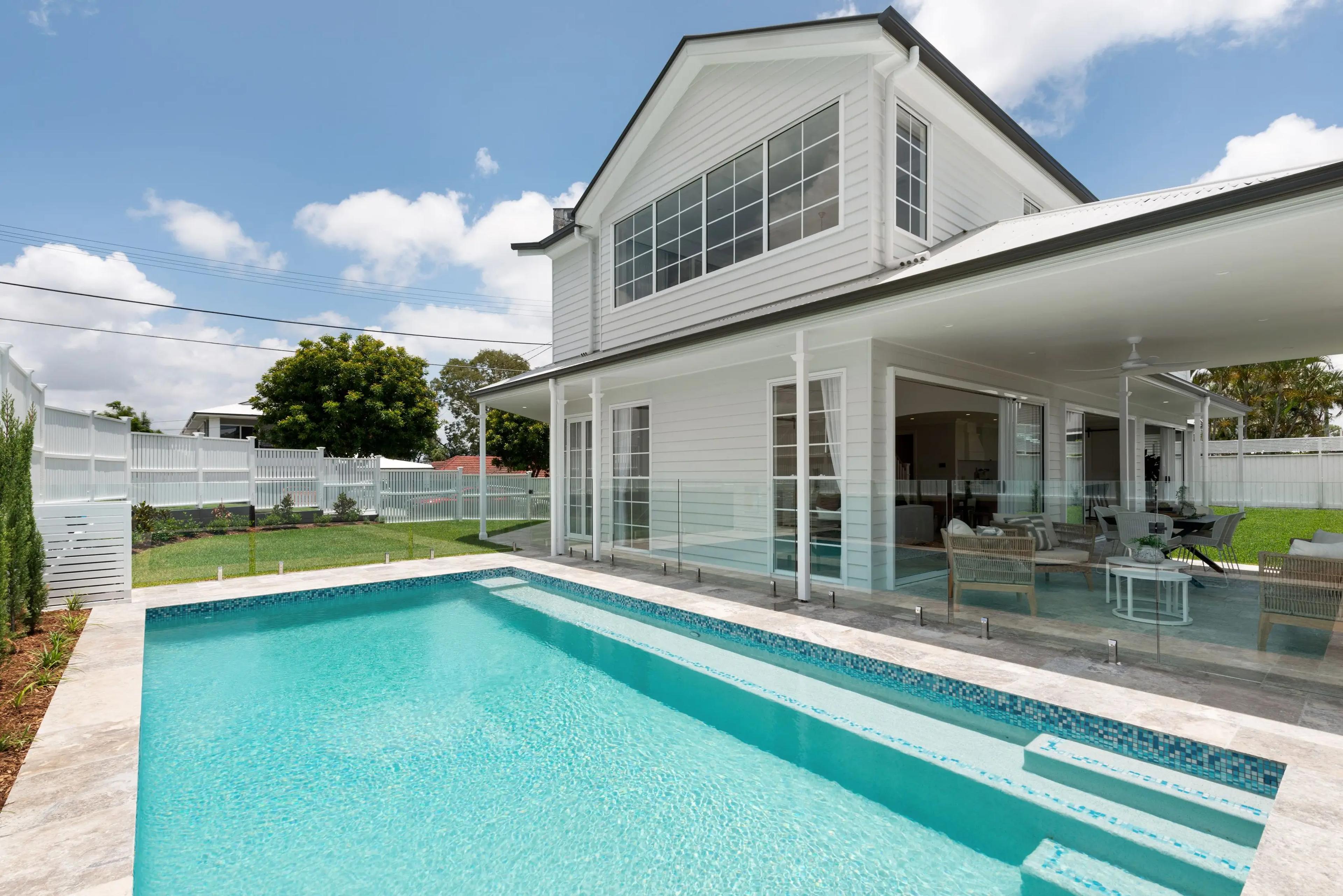 Rear exterior with swimming pool and glass fenced surround
