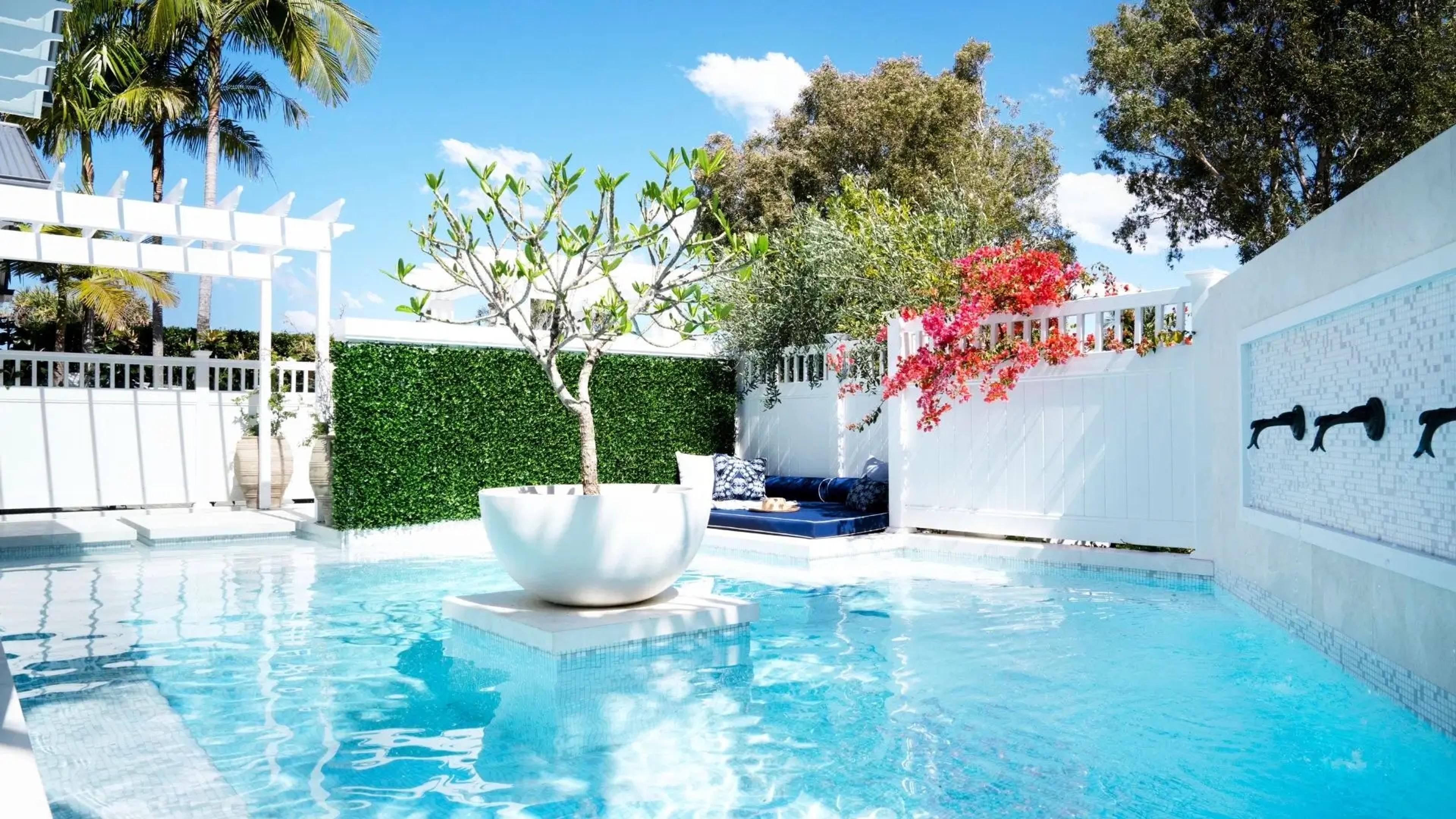 Resort style wrap-around pool in a coastal waterfront home