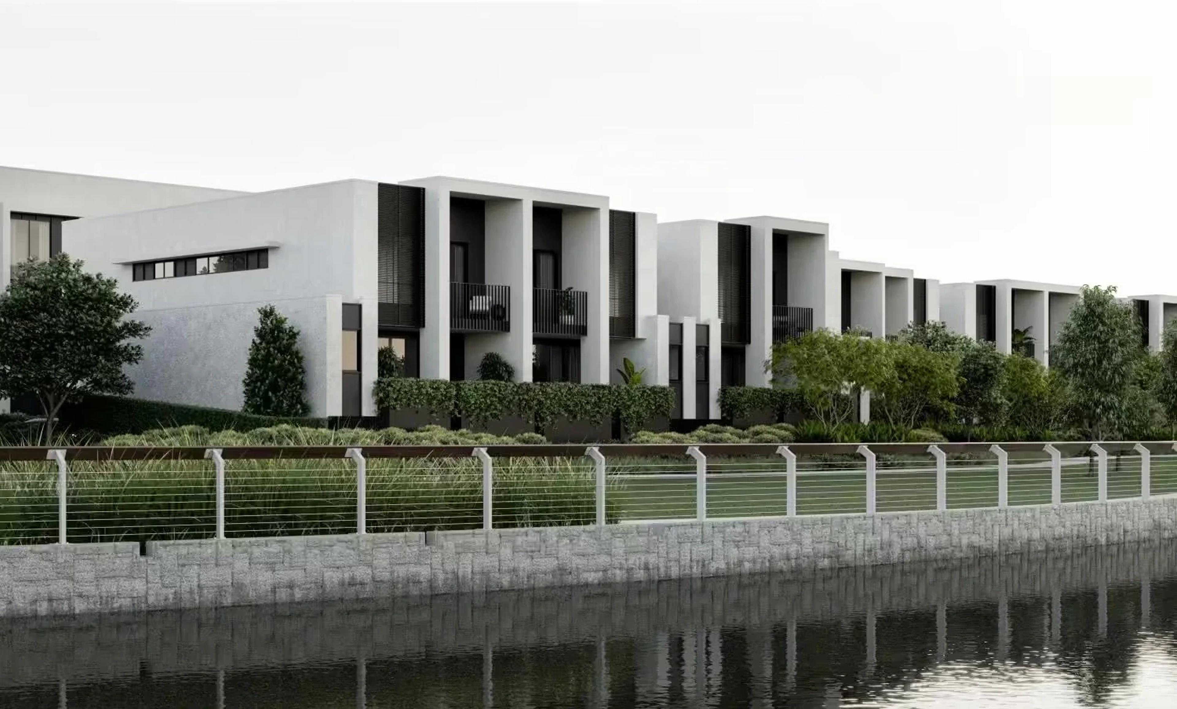 Modern townhouse development beside a lake, exterior render