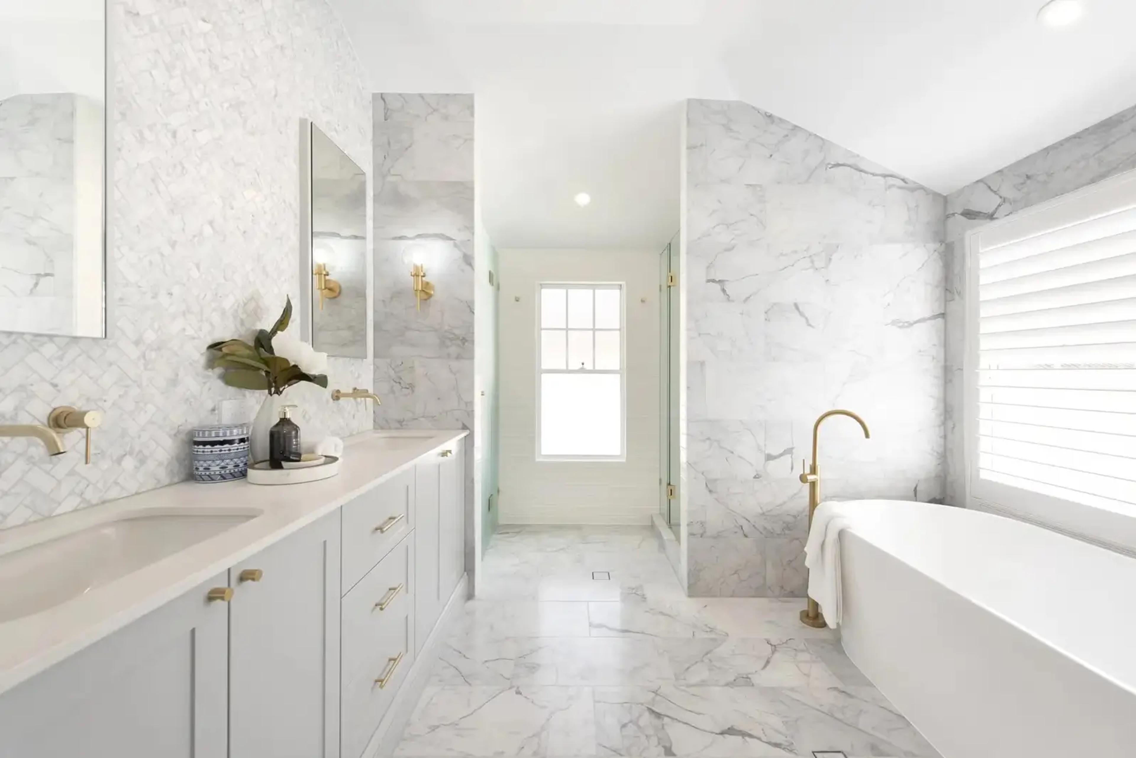 Marble ensuite with freestanding bath, double vanity and shower