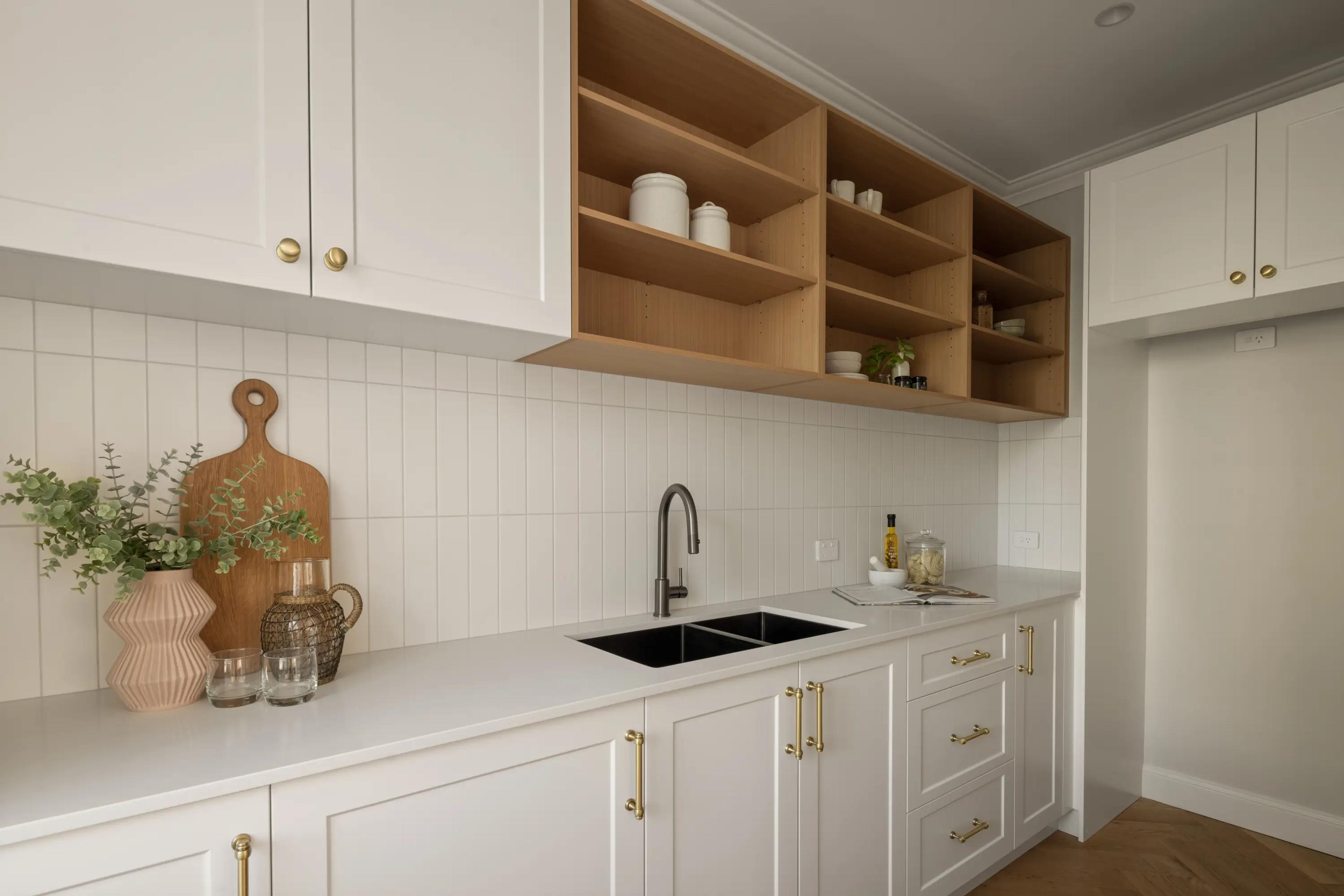 Butler pantry with timber shelving and white cabinetry