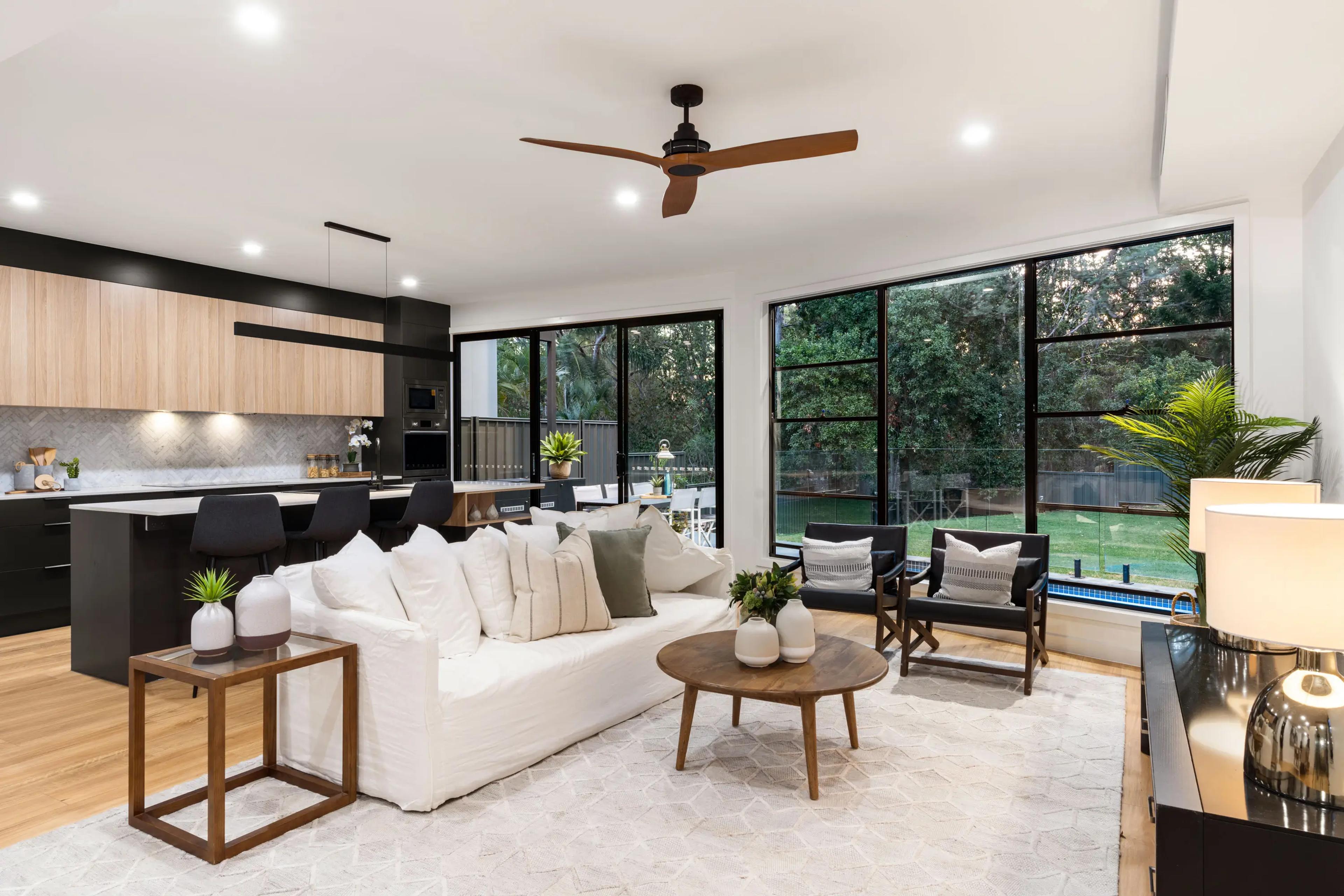 Open plan living and kitchen with large windows to garden