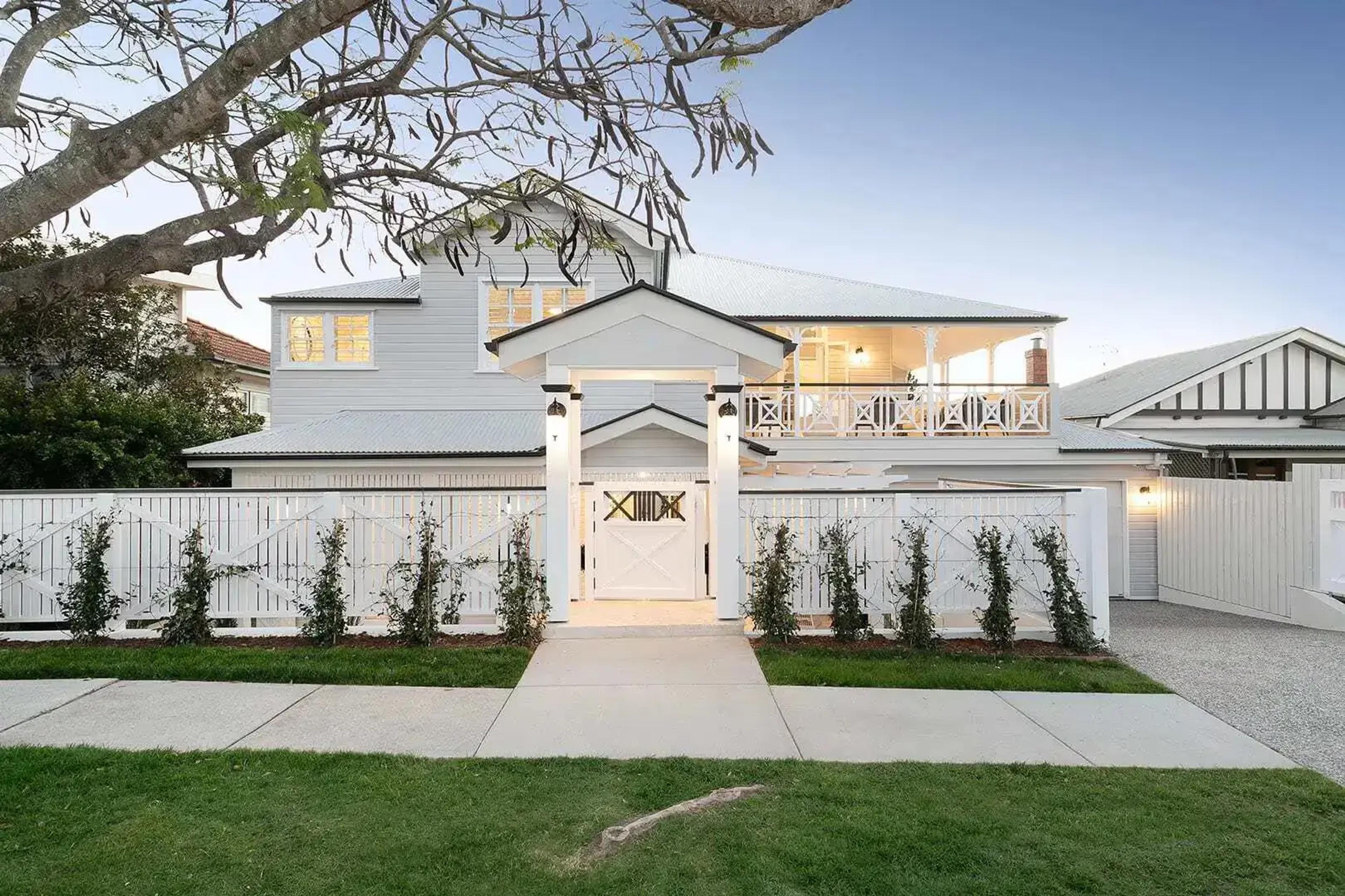 Luxury home renovations in Ascot featuring a restored pre-war Queenslander exterior.