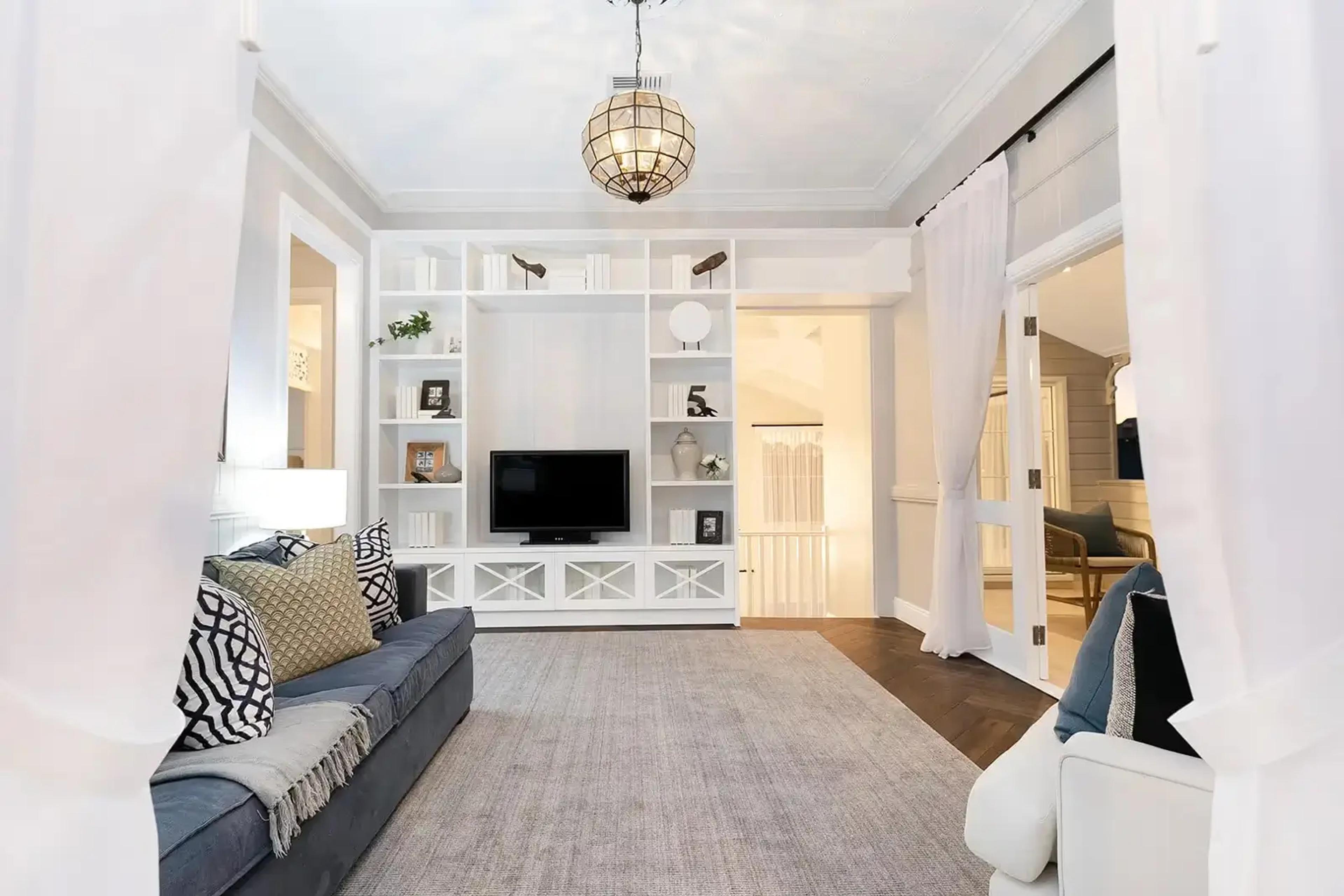 Upstairs retreat with built in media unit and barn door