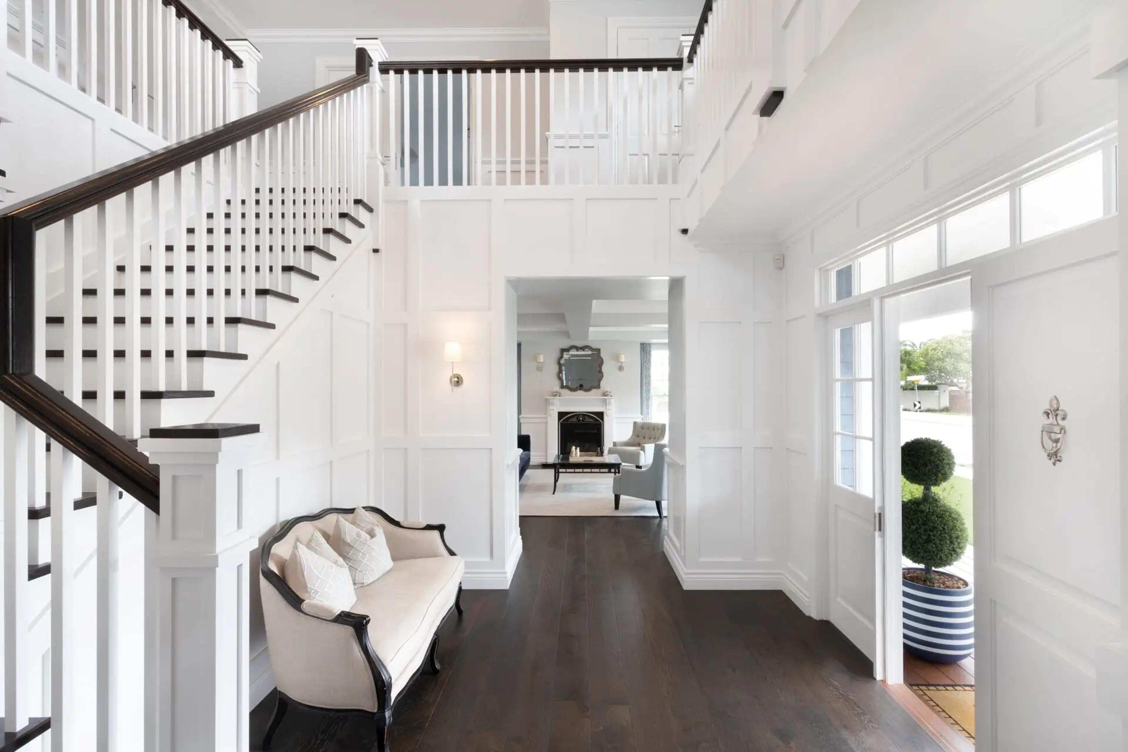 Entry hall with timber staircase and front door