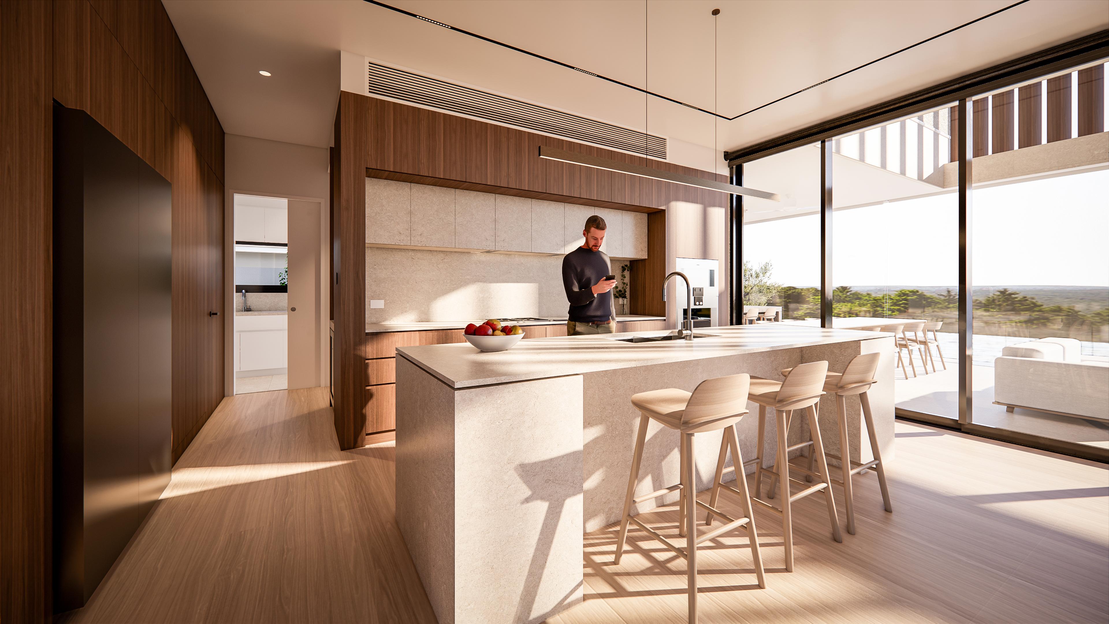Kitchen island with sink and stools, walnut cabinetry and a glimpse into the adjoining butlers pantry
