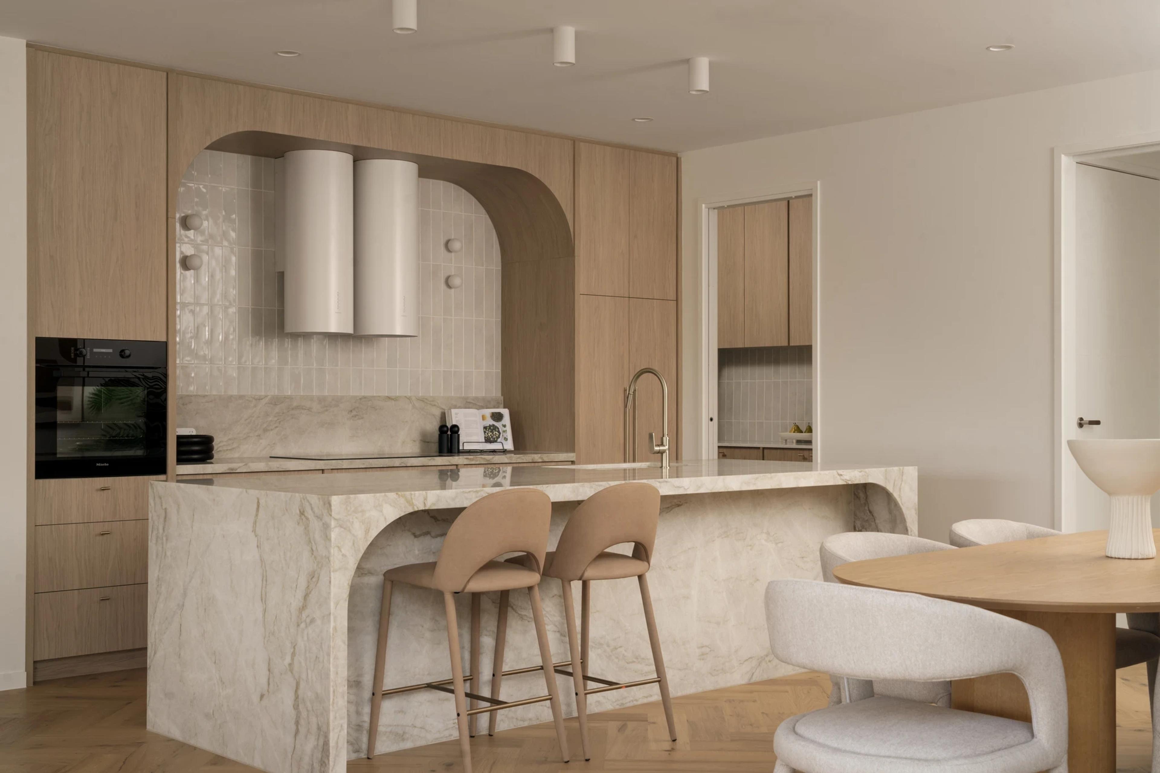 Kitchen with arched tiled splashback and stone island bench