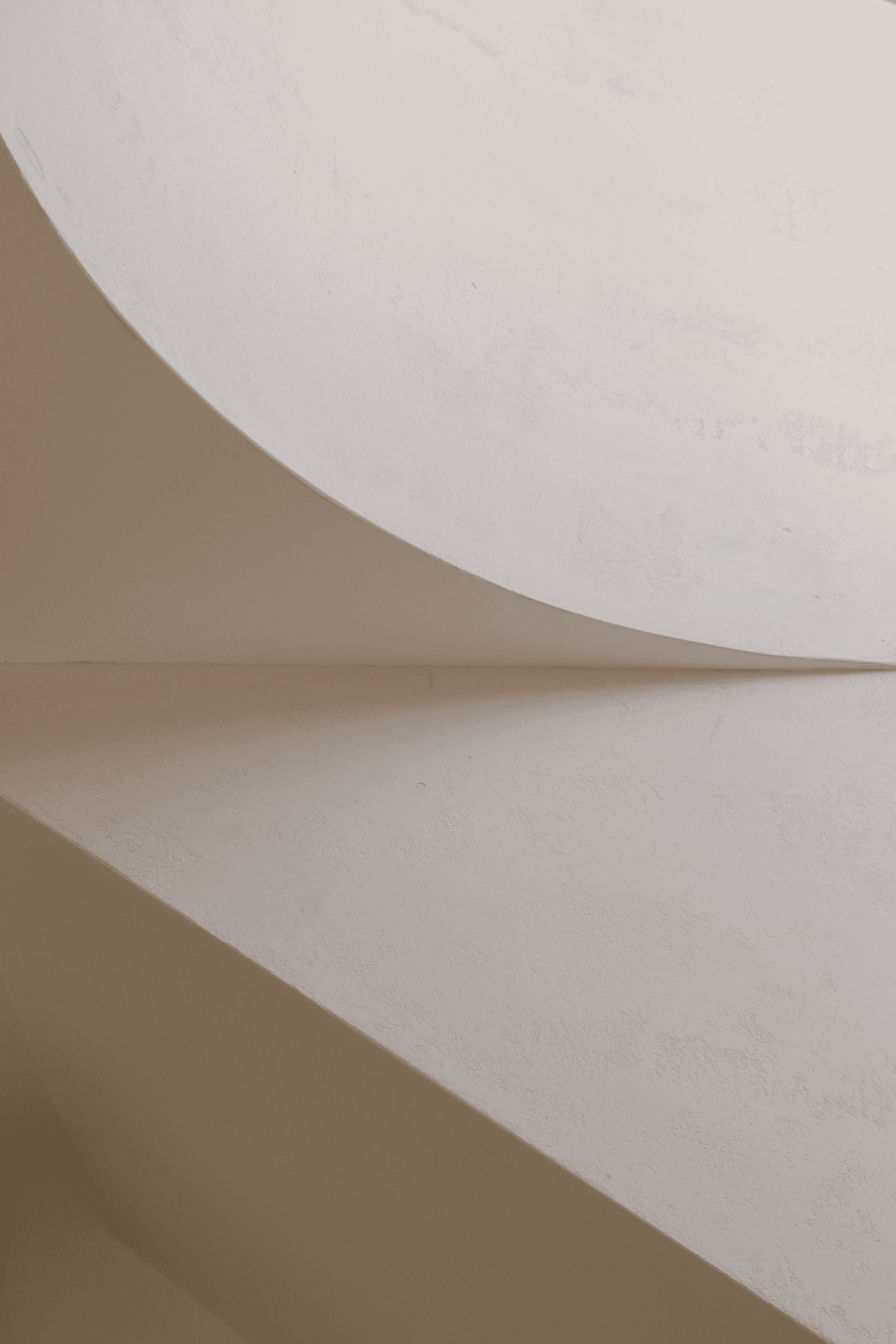 Abstract curved white plaster wall and ceiling detail