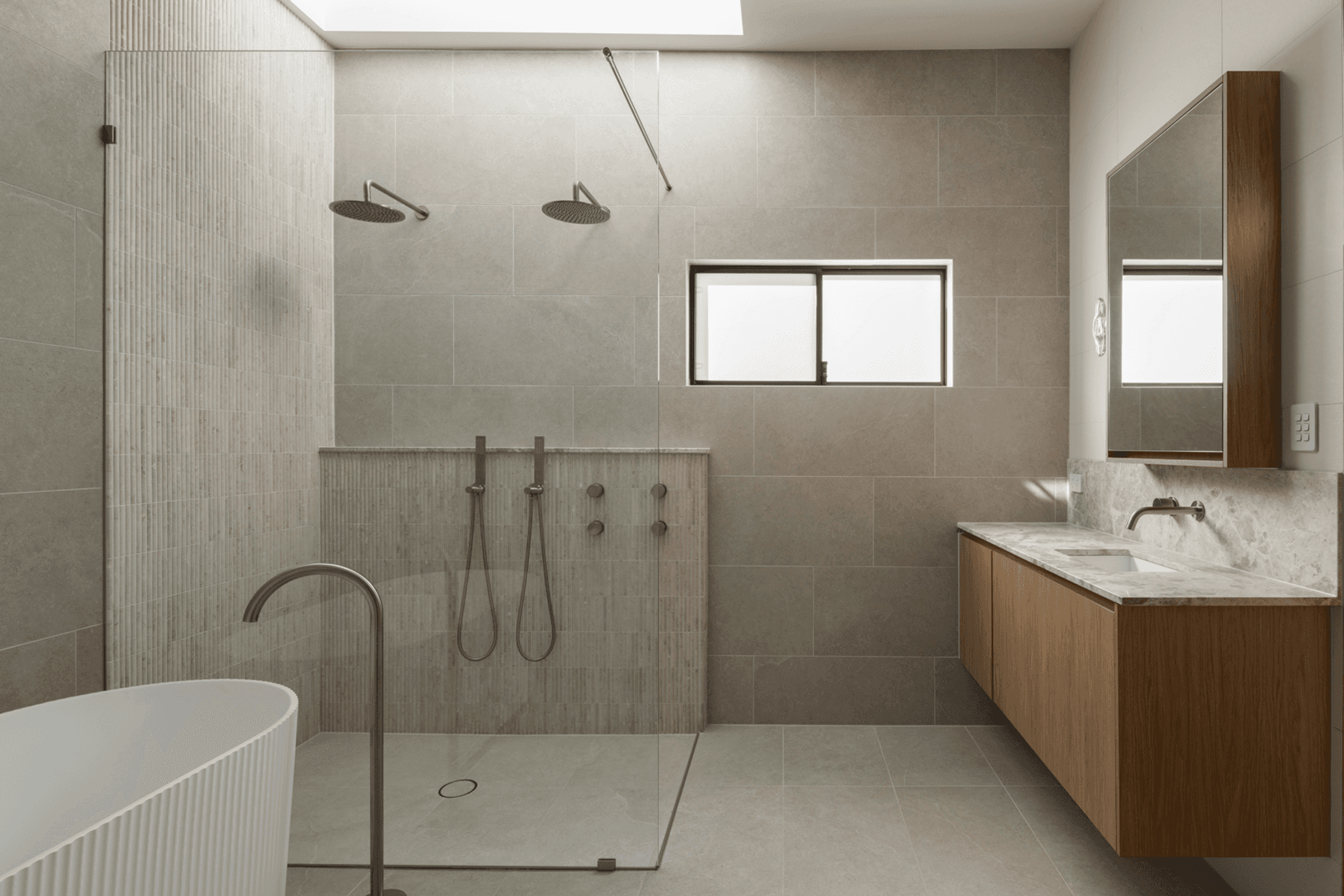 Bathroom with double shower, bath and timber vanity