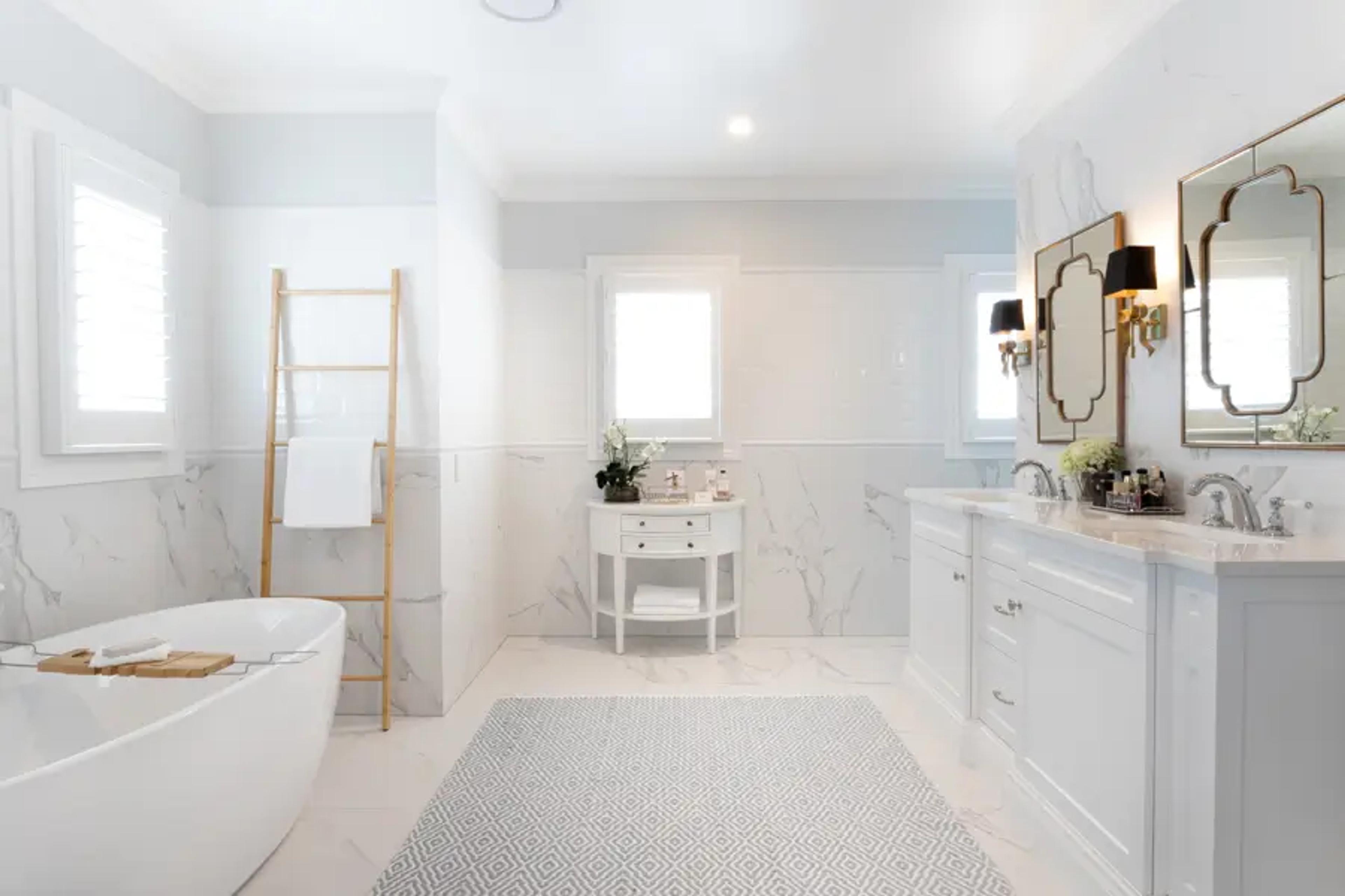 Marble ensuite with freestanding bath and twin vanity