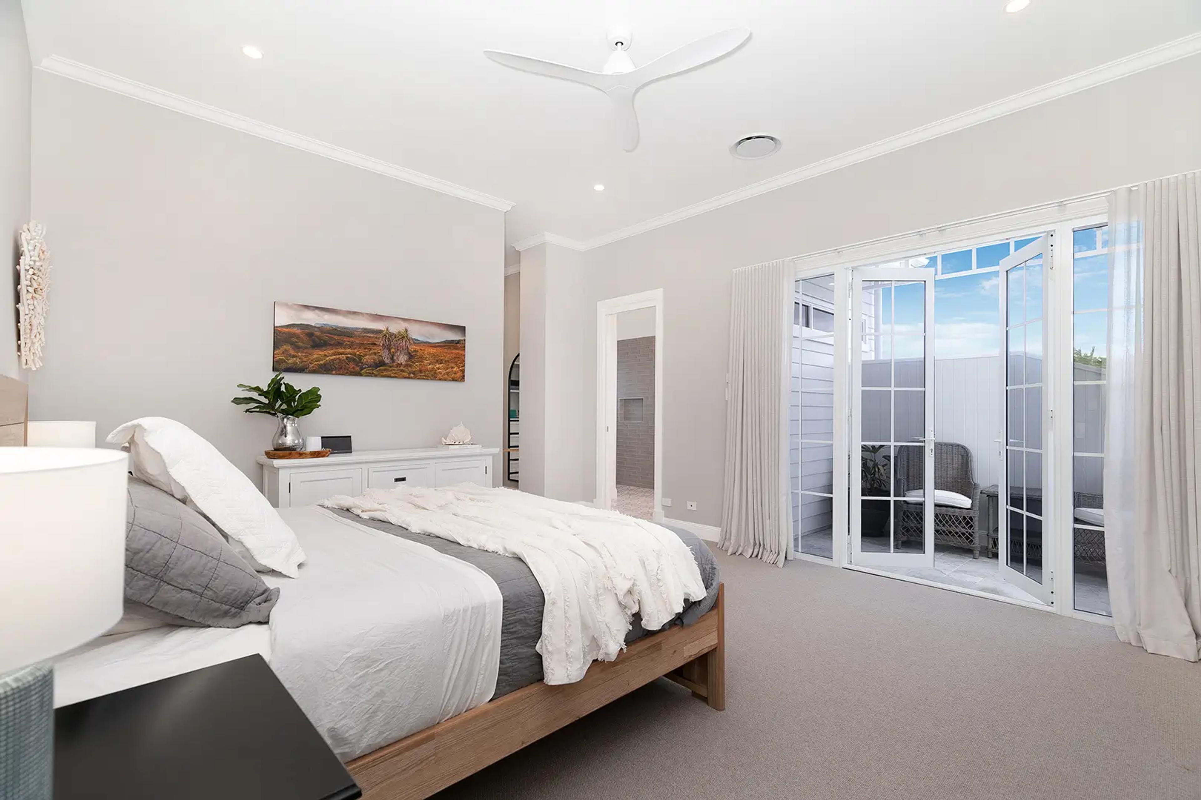 Bedroom with French doors opening to a courtyard